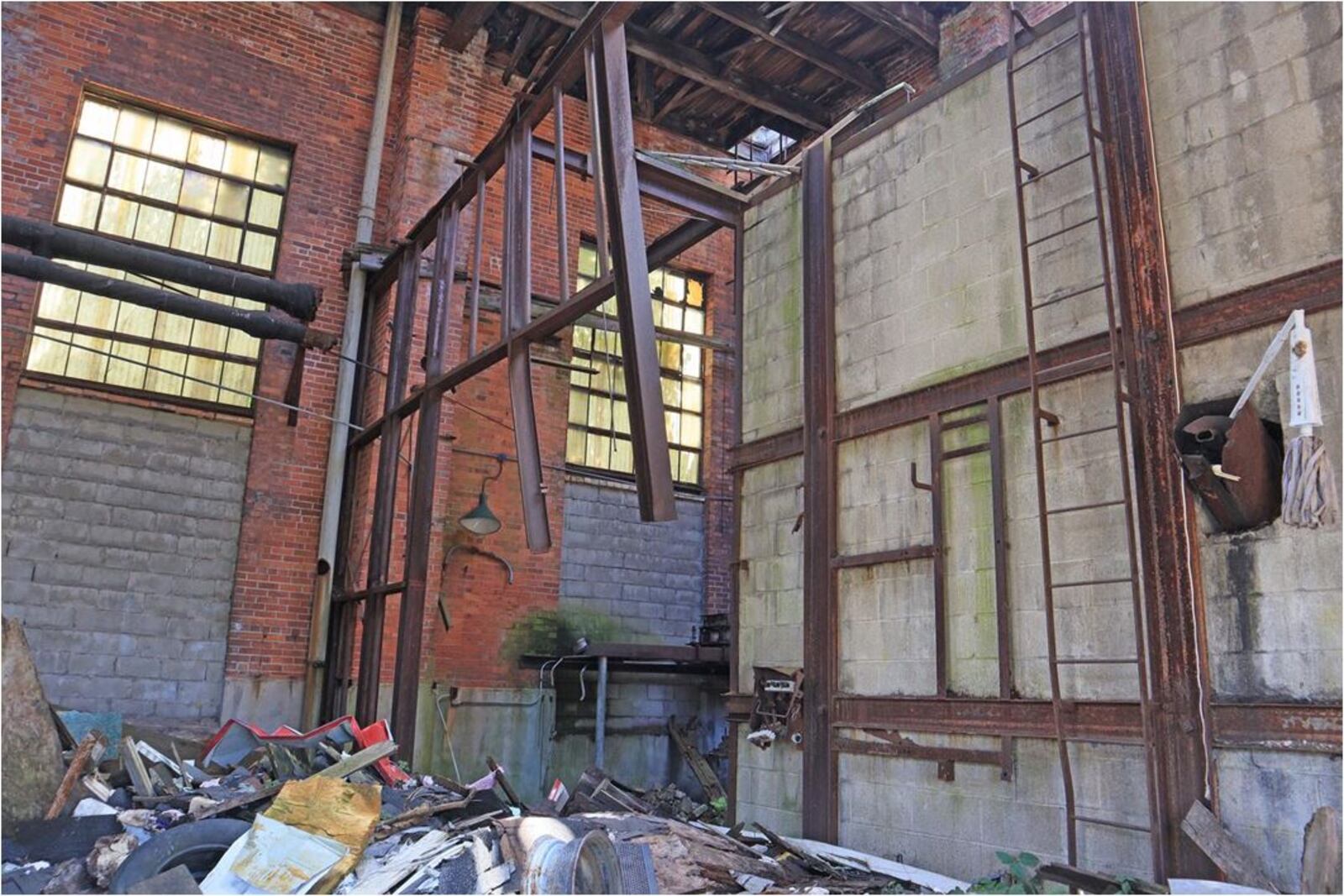 The former dairy building remains open to children and vandals. PROVIDED