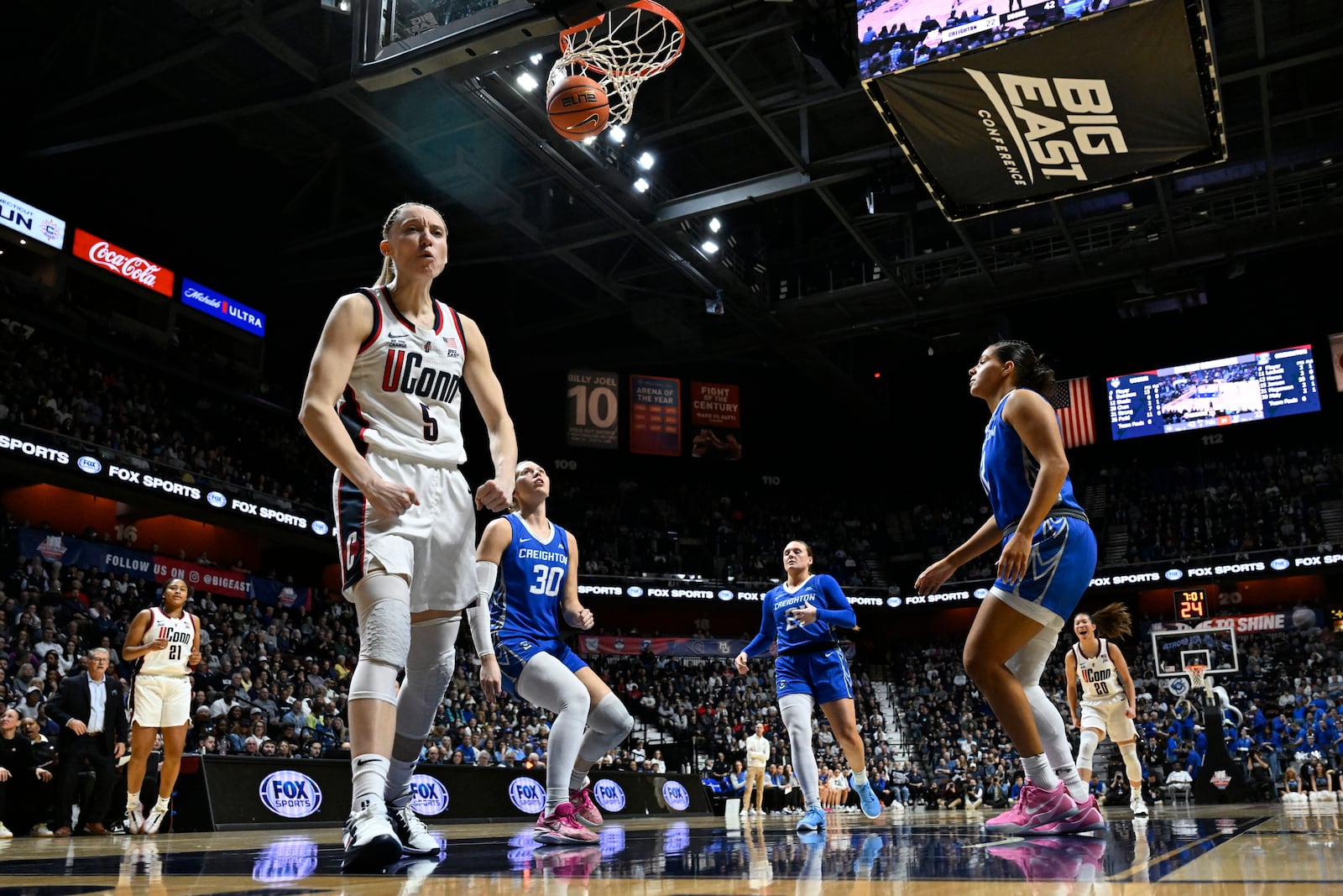 UConn guard Paige Bueckers (5) reacts after making a basket while being fouled during the second half of an NCAA college basketball game against Creighton in the finals of the Big East Conference tournament, Monday, March 10, 2025, in Uncasville, Conn. (AP Photo/Jessica Hill)