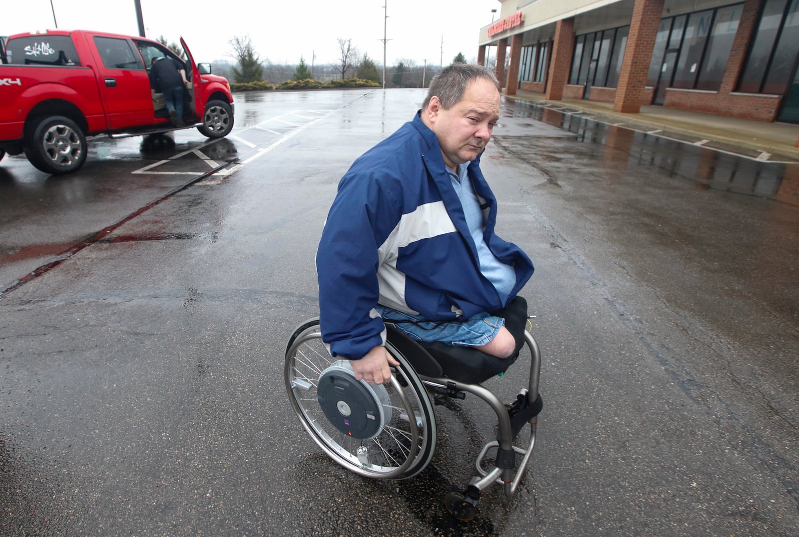 A proposed state law that would require drivers to move over for garbage trucks may prevent devastating injuries to workers like Kenny Lawson of Germantown who lost both his legs in a 1996 crash. CHRIS STEWART / STAFF