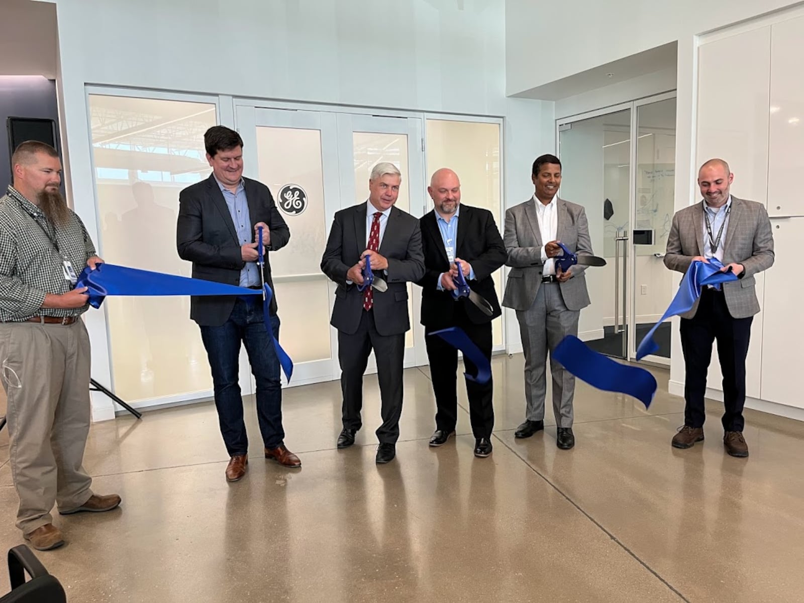 GE Aerospace officials cut the ribbon on their new Beavercreek production site. THOMAS GNAU/STAFF