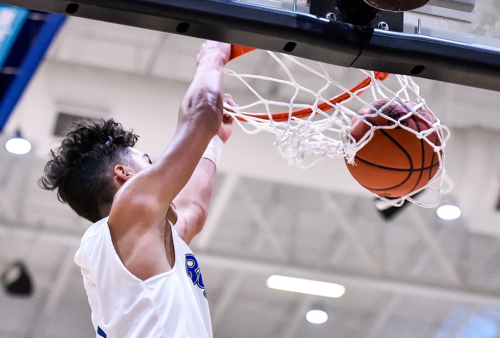 Hamilton’s Trey Robinson throws down a slam dunk on a fast break during Friday night’s game against Princeton at the Hamilton Athletic Center. Princeton won 44-43. NICK GRAHAM/STAFF