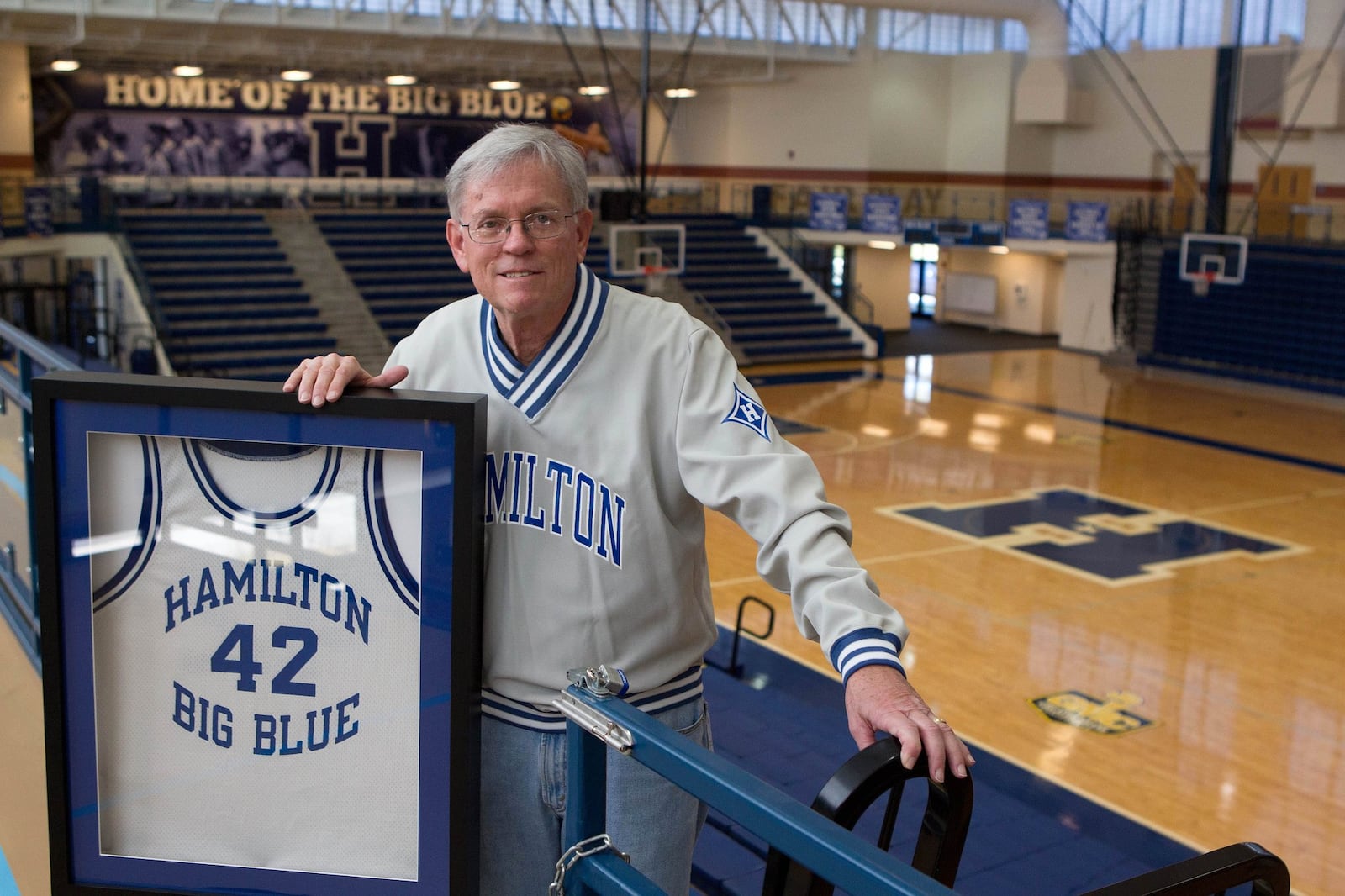 Former Hamilton High School basketball coach John Smith with the jersey of Kwasi Sherman.