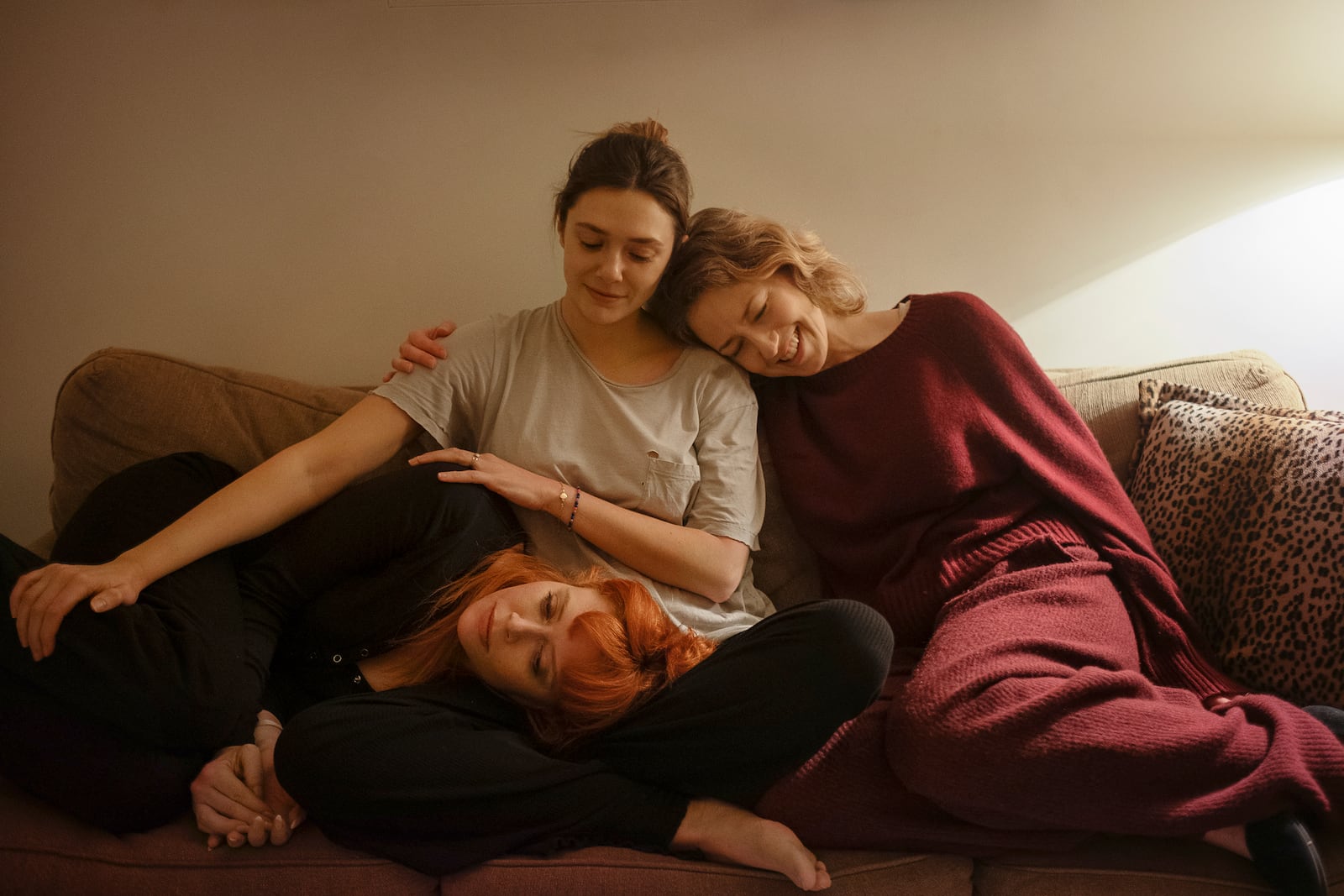 This image released by Netflix shows Natasha Lyonne, from left, Elizabeth Olsen, and Carrie Coon in a scene from "His Three Daughters." (Netflix via AP)