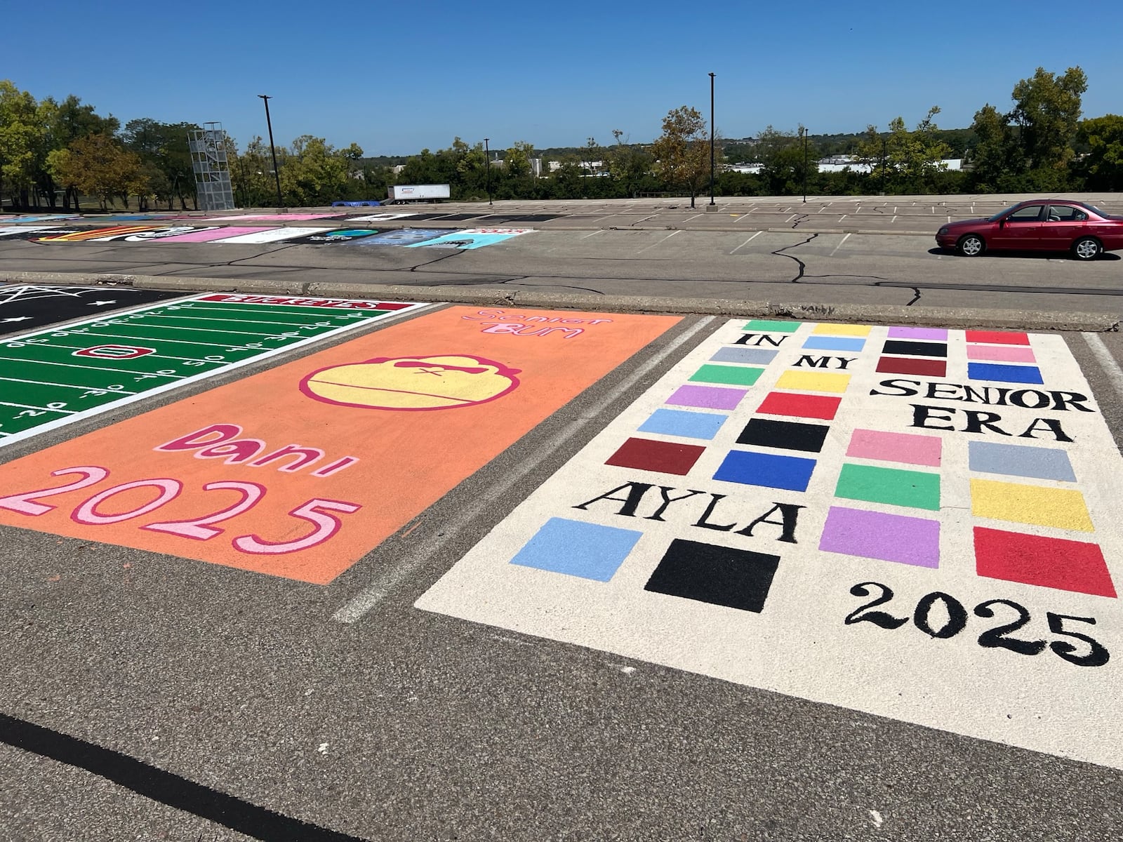 Fairfield High School seniors painted their parking lot spaces for the 2024-2025 school year. AMY BURZYNSKI/STAFF