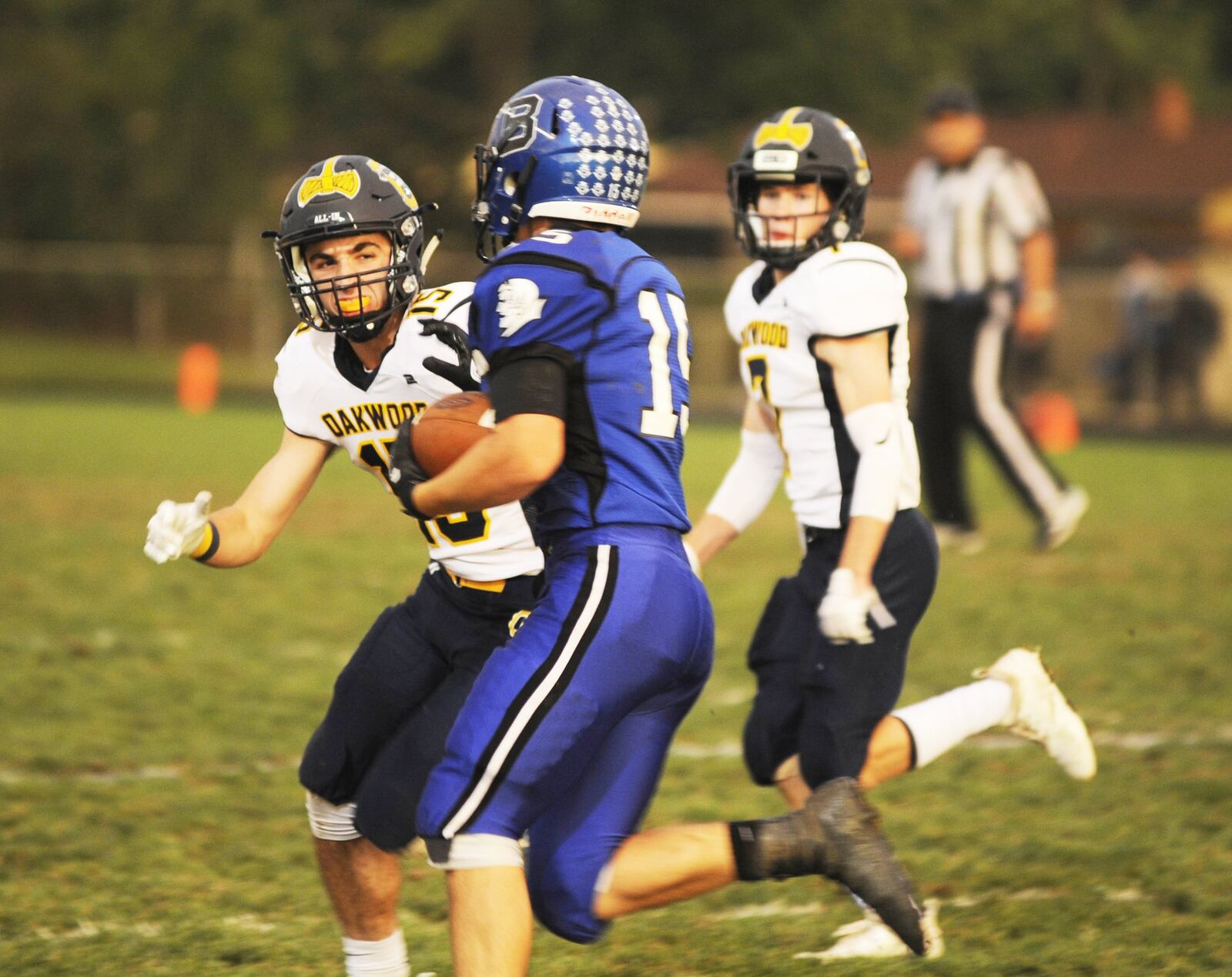 Oakwood’s Jake Sargent (left) targets Jack Meyers. Brookville defeated visiting Oakwood 48-14 in a Week 6 high school football game on Thursday, Sept. 27, 2018. MARC PENDLETON / STAFF