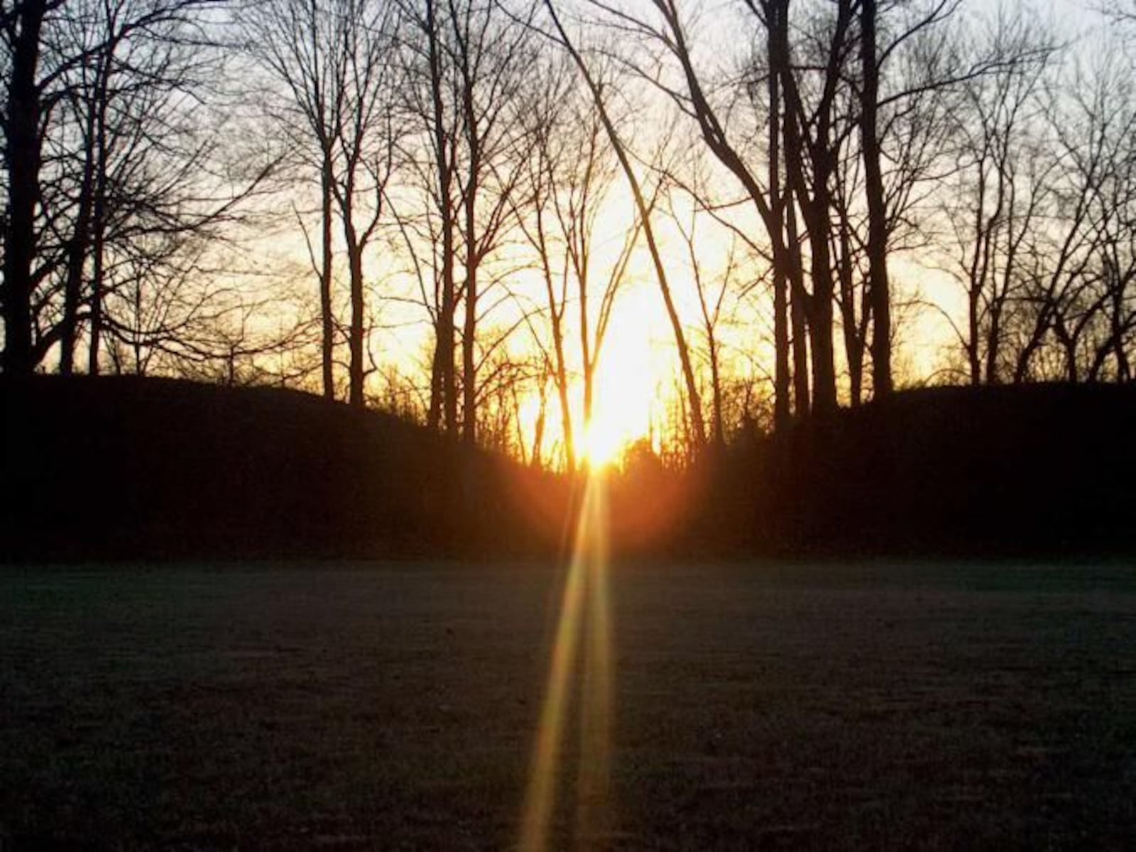 Sunrise Between the Mounds of Fort Ancient Earthworks