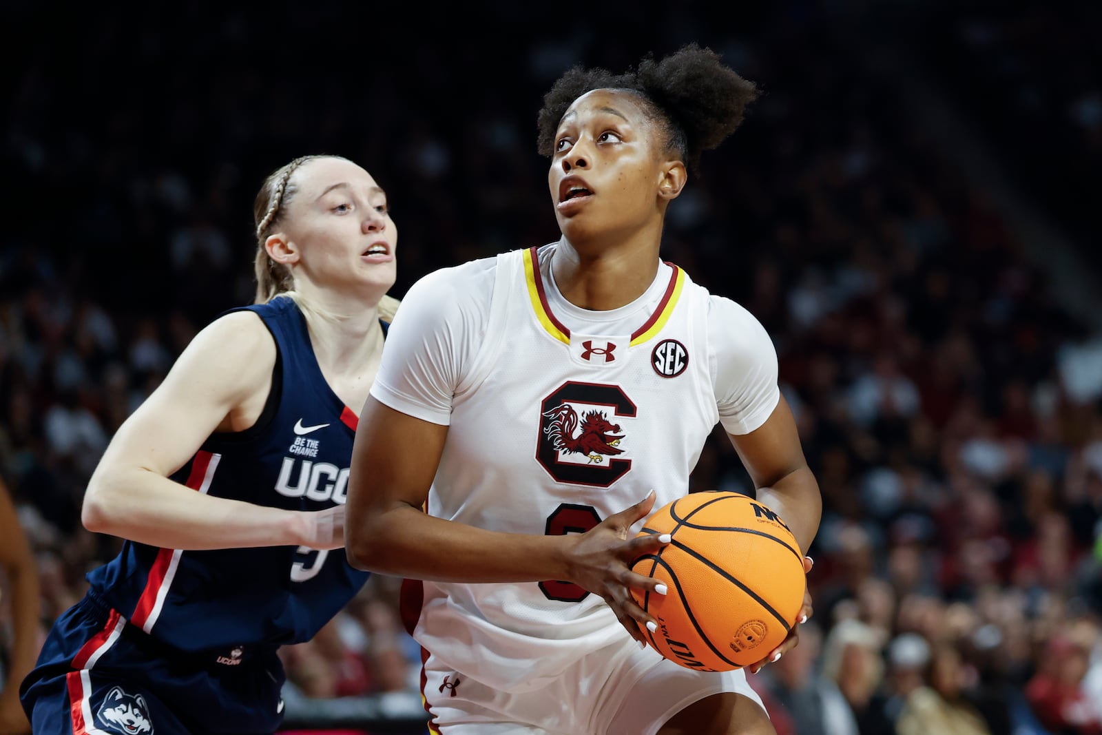 South Carolina forward Joyce Edwards, right, looks to shoot against UConn guard Paige Bueckers during the first half of an NCAA college basketball game in Columbia, S.C., Sunday, Feb. 16, 2025. (AP Photo/Nell Redmond)