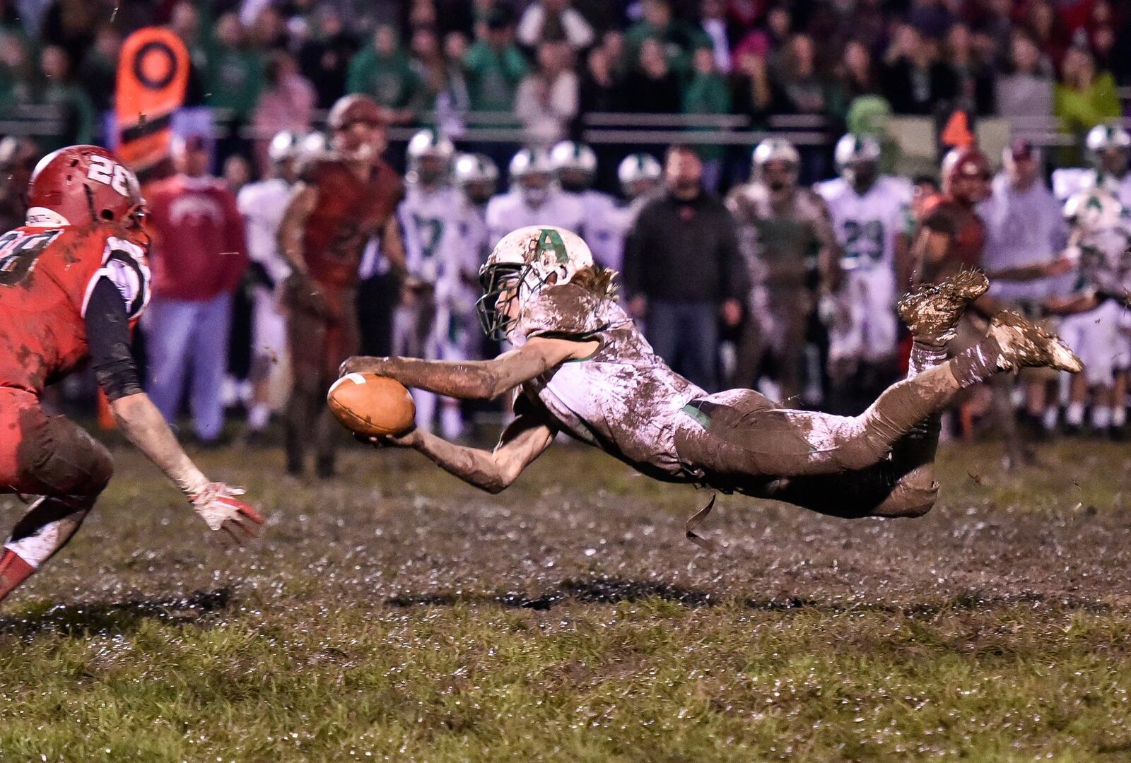 Anna’s Caleb Kauffman can’t quite make the catch in a Division V, Region 20 playoff game against Madison on Friday night at Brandenburg Field in Madison Township. NICK GRAHAM/STAFF