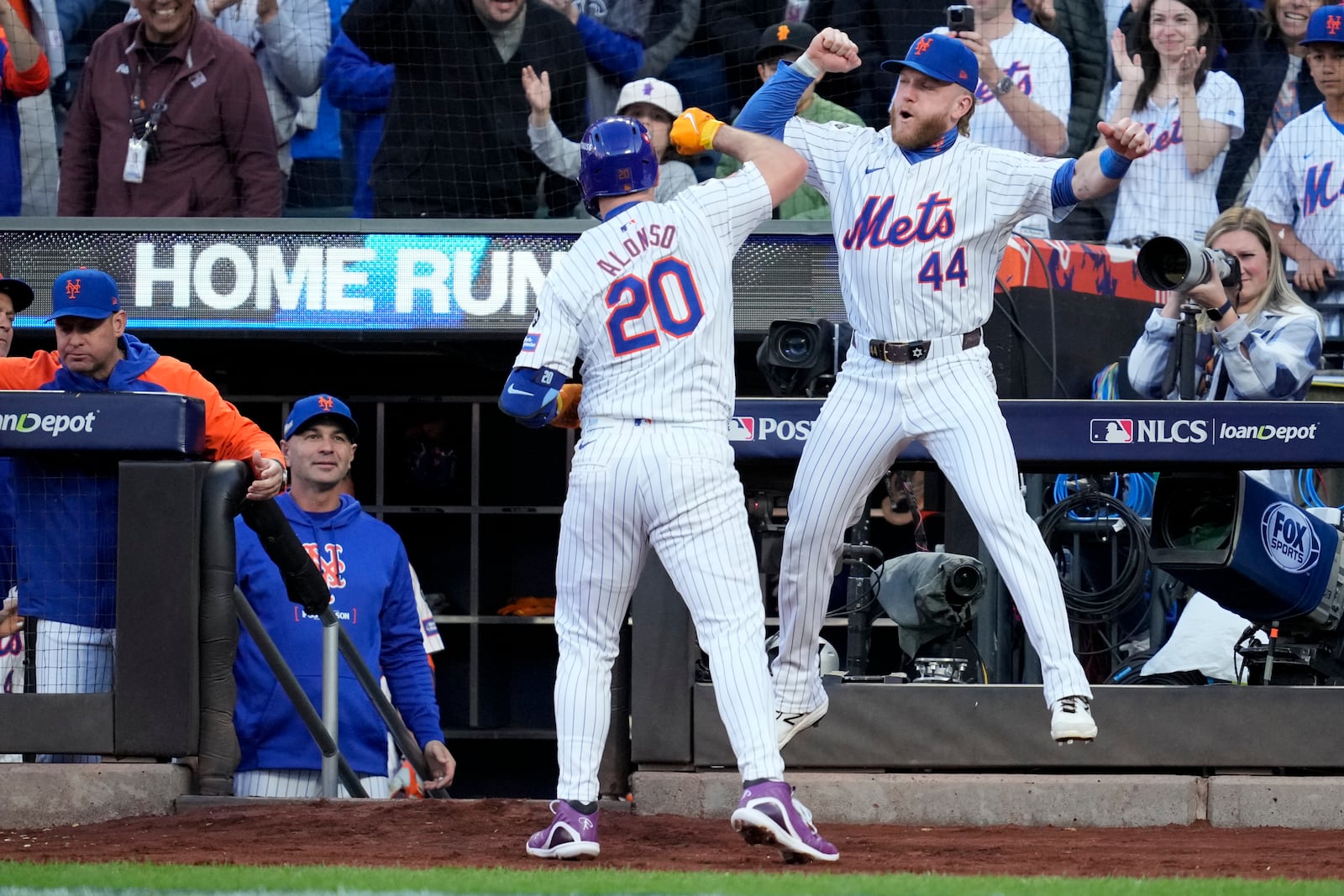 New York Mets' Pete Alonso celebrates a three-run home run against the Los Angeles Dodgers during the first inning in Game 5 of a baseball NL Championship Series, Friday, Oct. 18, 2024, in New York. (AP Photo/Ashley Landis)