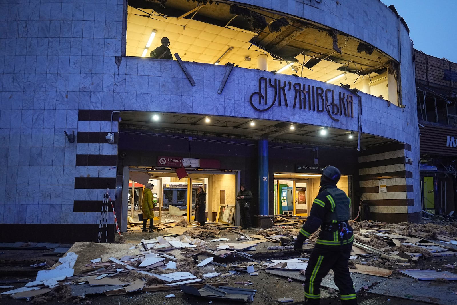 Firefighters work at the site of a damaged metro station after a Russian missile attack in Kyiv, Ukraine, Saturday, Jan. 18, 2025. (AP Photo/Efrem Lukatsky)