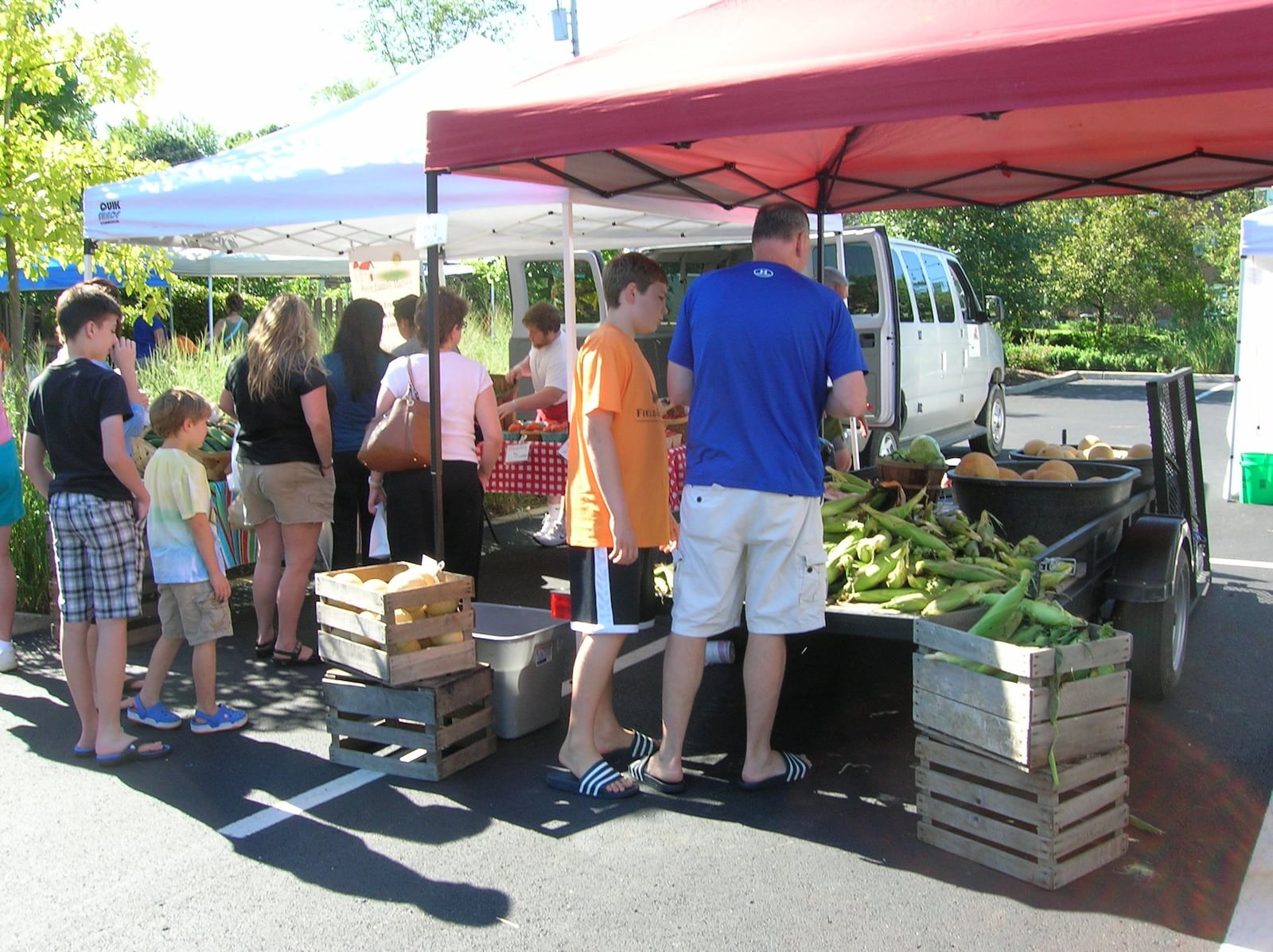 Crowds peruse the local produce at the Oakwood Farmers Market. From now through the end of the market season is a great time to find fruits and vegetables. SARA MASTBAUM THOMAS/CONTRIBUTED