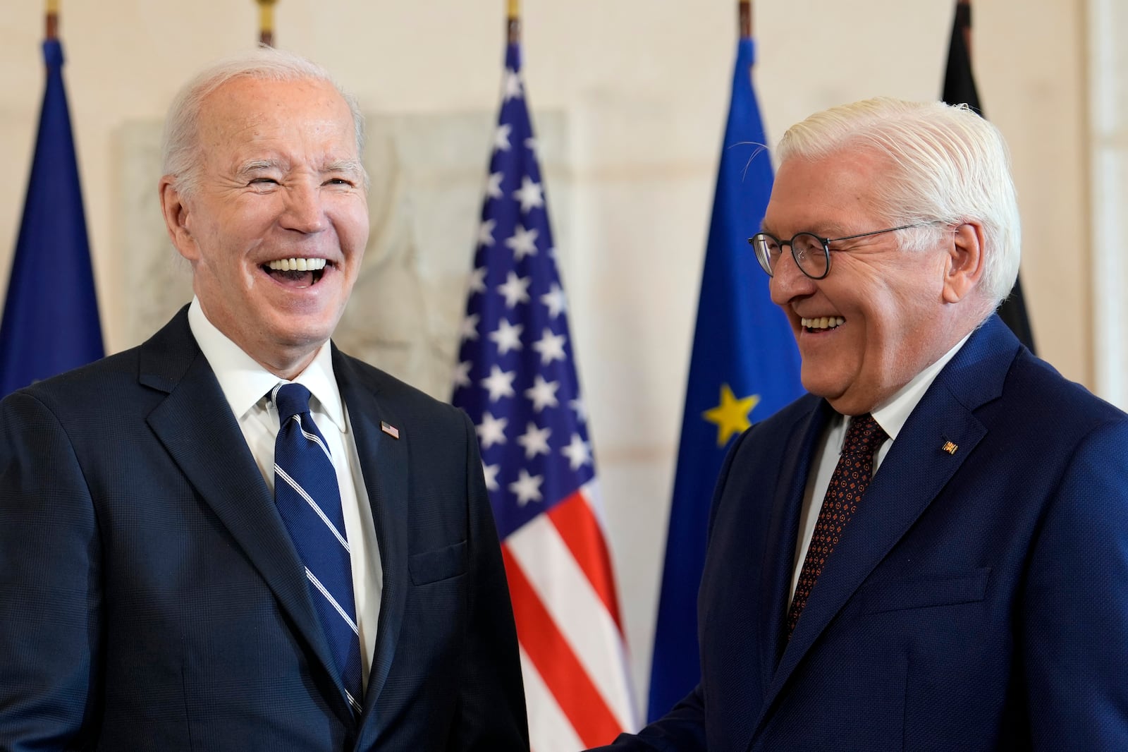 President Joe Biden, left, is greeted by German President Frank-Walter Steinmeier during the welcoming ceremony at Bellevue Palace in Berlin, Germany, Friday, Oct. 18, 2024. (AP Photo/Ben Curtis)