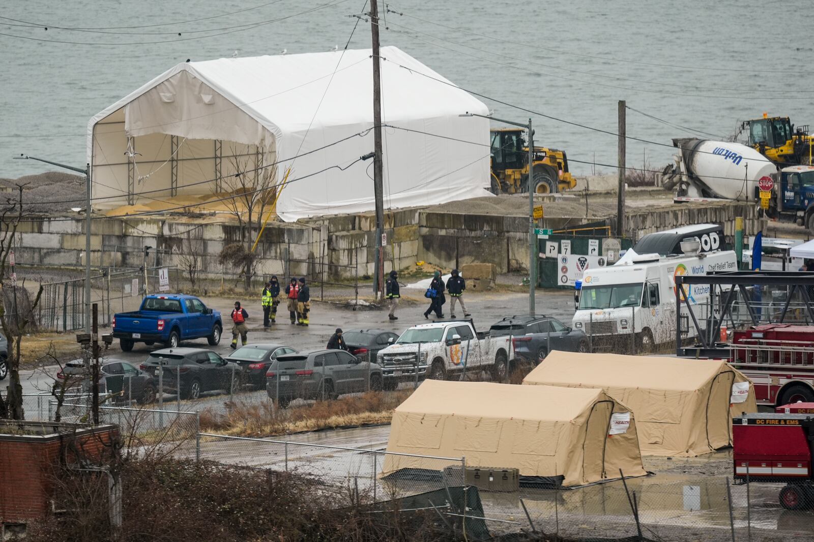 Emergency vehicles and recovery operations are seen near the mouth of the Anacostia River at the Potomac River near Ronald Reagan Washington National Airport, Friday, Jan. 31, 2025, in Washington. (AP Photo/Carolyn Kaster)