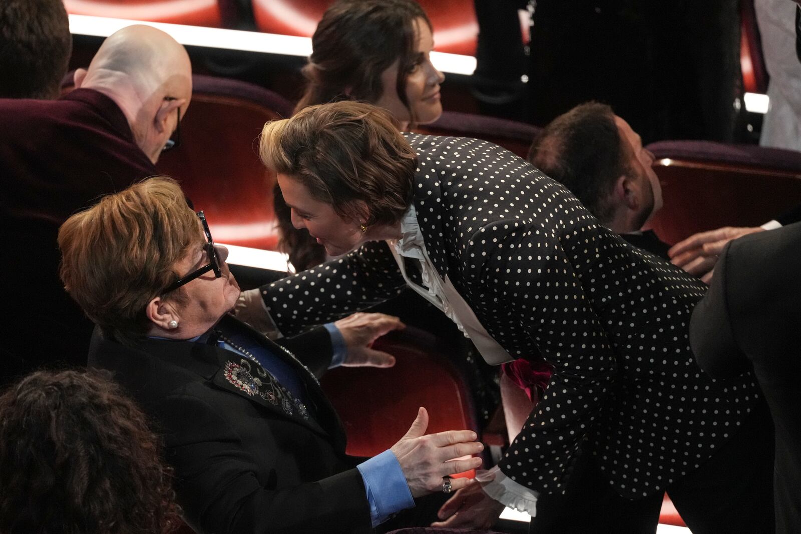 Elton John, left, and Brandi Carlile in the audience during the Oscars on Sunday, March 2, 2025, at the Dolby Theatre in Los Angeles. (AP Photo/Chris Pizzello)