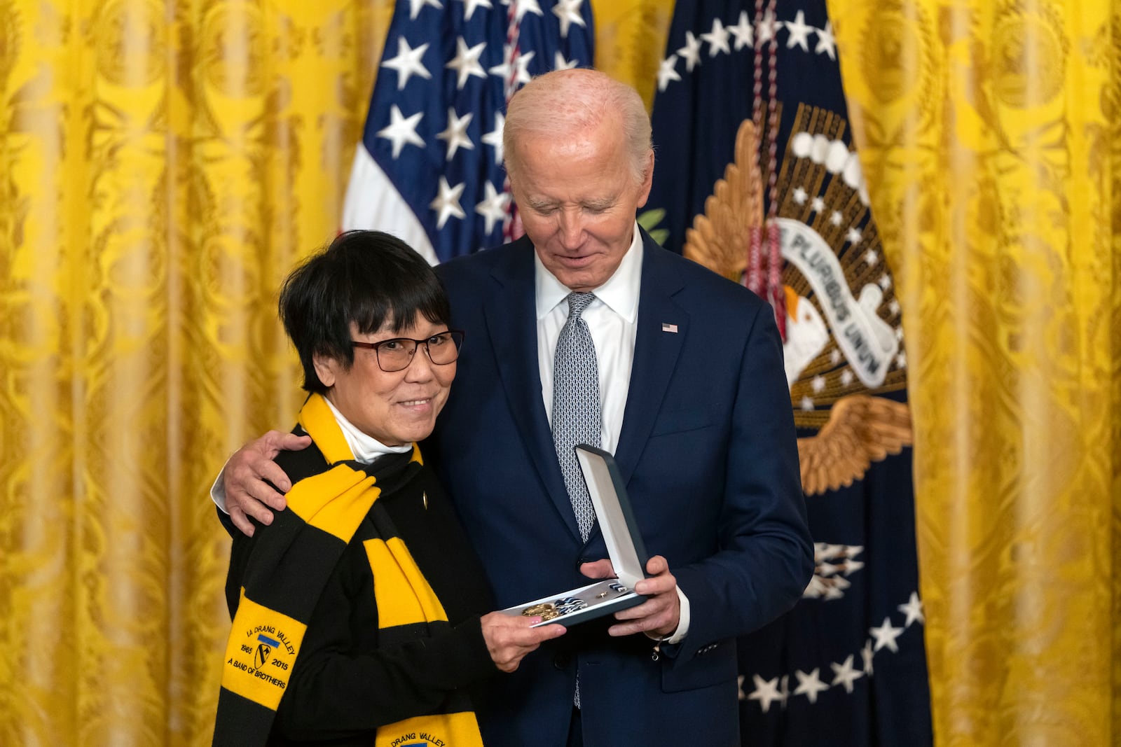 President Joe Biden awards the Presidential Citizens Medal to Gracie Galloway on behalf of Joseph Galloway during a ceremony in the East Room at the White House, Thursday, Jan. 2, 2025, in Washington. (AP Photo/Mark Schiefelbein)