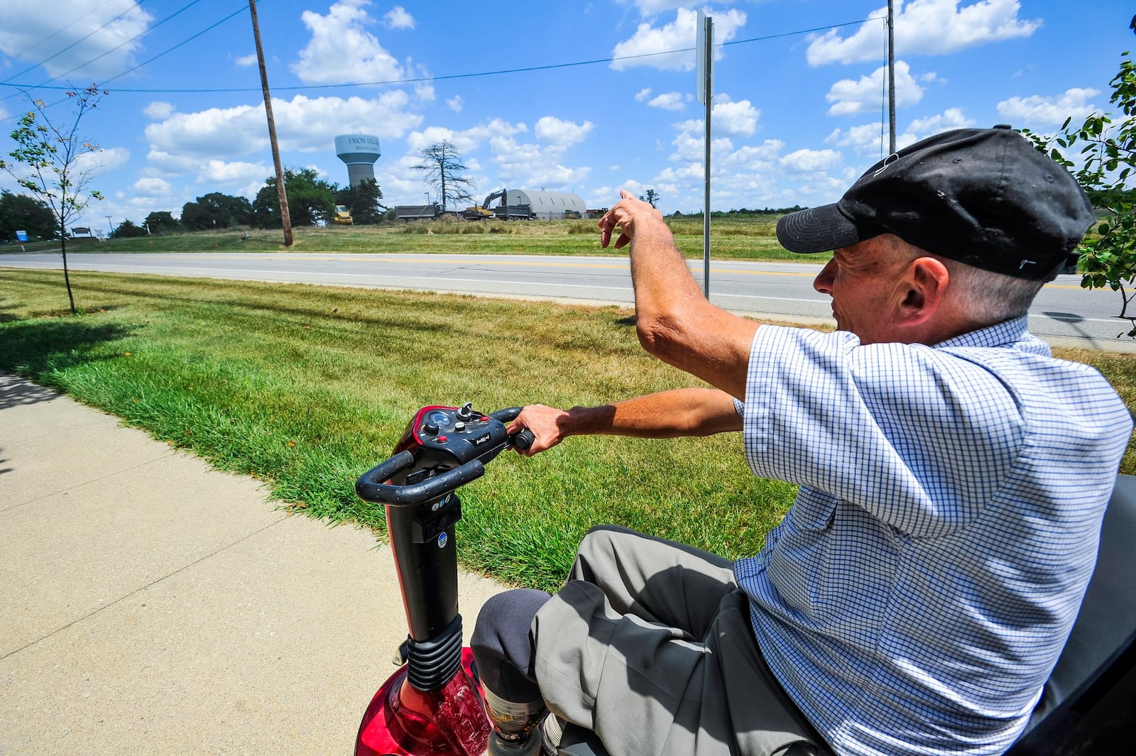 Lynn “Popcorn” Weber rides around the Otterbein Senior Life campus on July 18. Weber, 70, has battled some health issues, including diabetes. His left leg was amputated below the knee after it became infected.