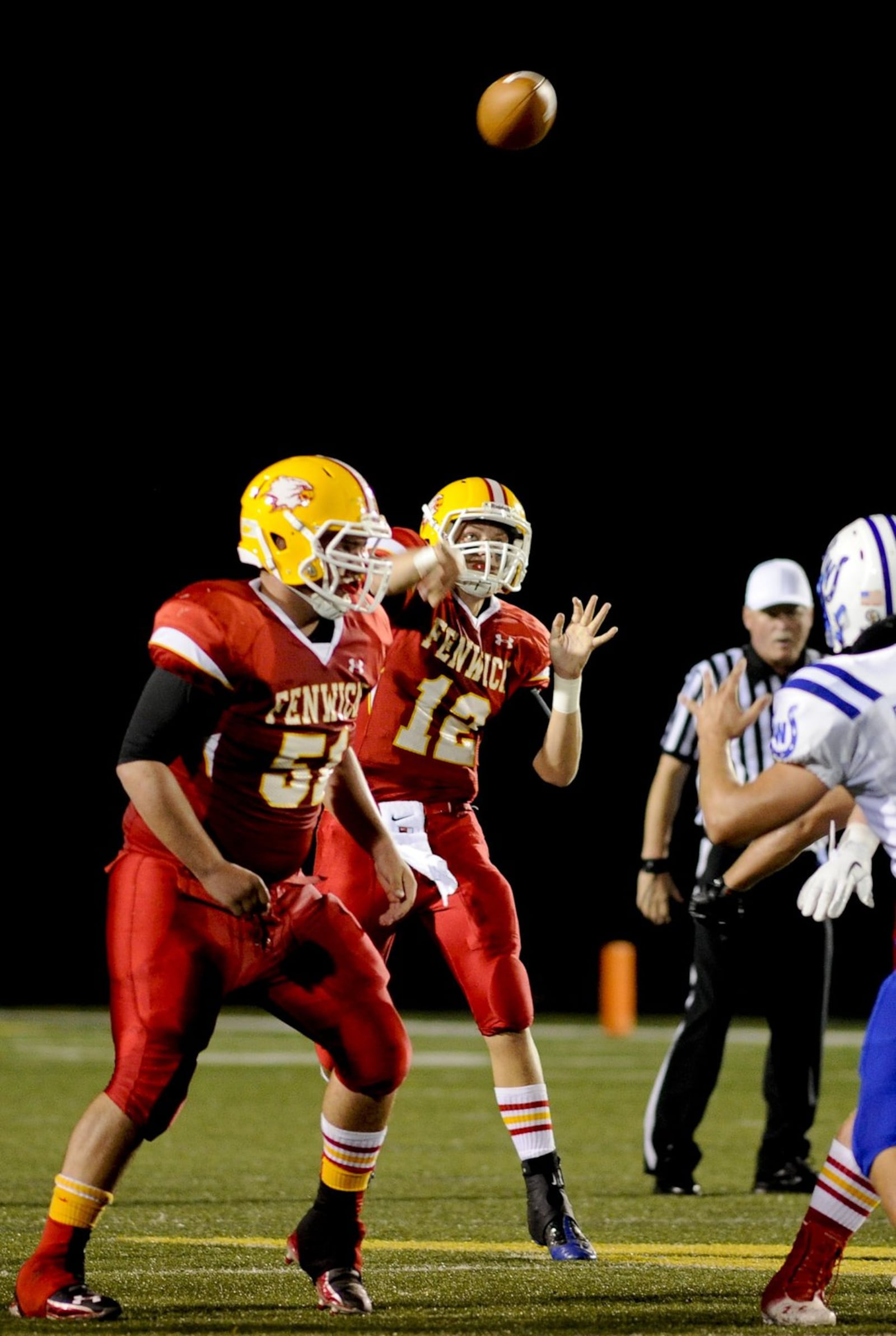 Fenwick quarterback Ricky Davis makes a throw against Wyoming during the Skyline Chili Crosstown Showdown on Aug. 23, 2012, at Sycamore Junior High School. NICK GRAHAM/STAFF