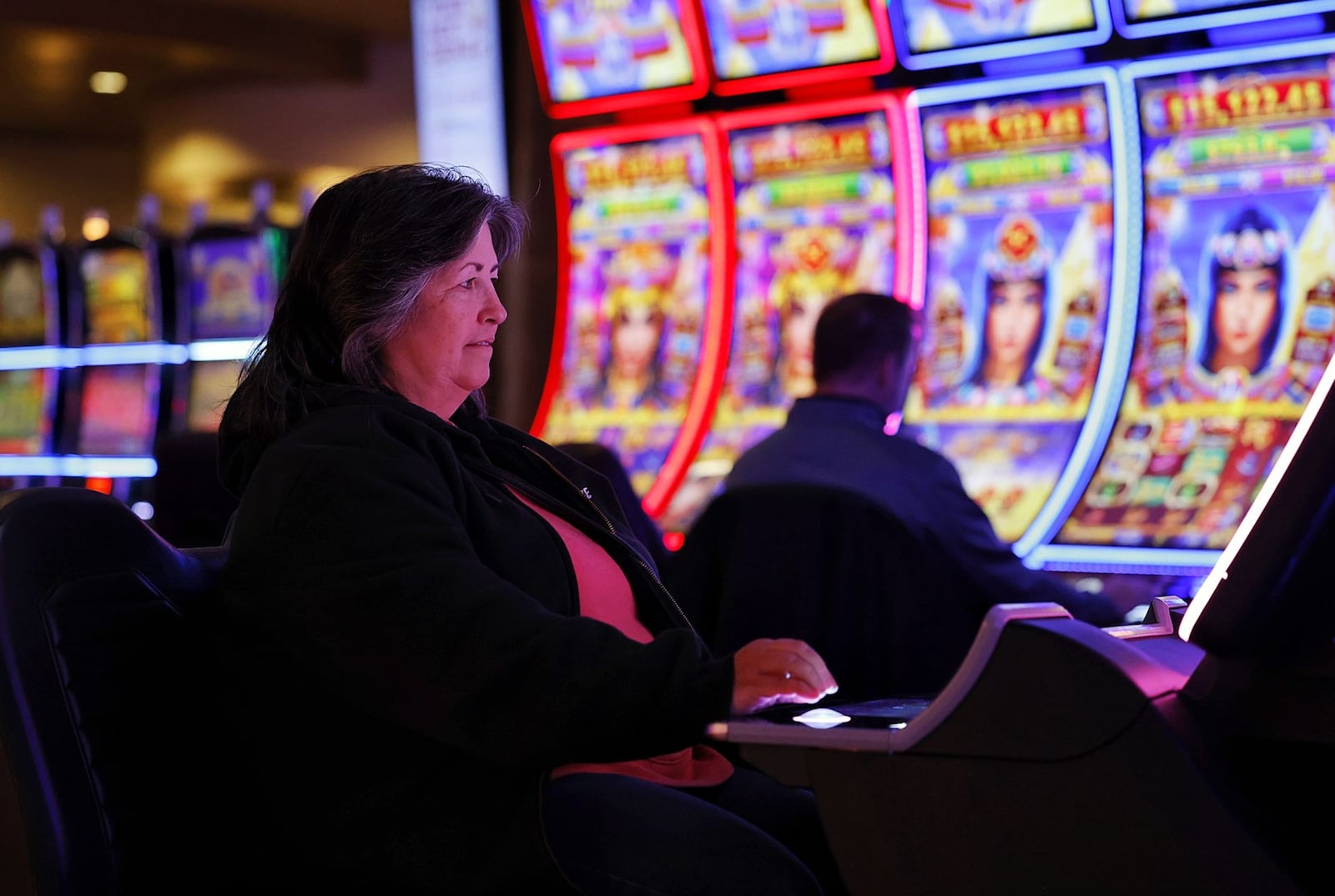 Tami Heinrich plays a game at Miami Valley Gaming that is in the process of expanding its outdoor gaming areas and renovating the former buffet area into two different dining concepts. NICK GRAHAM / STAFF