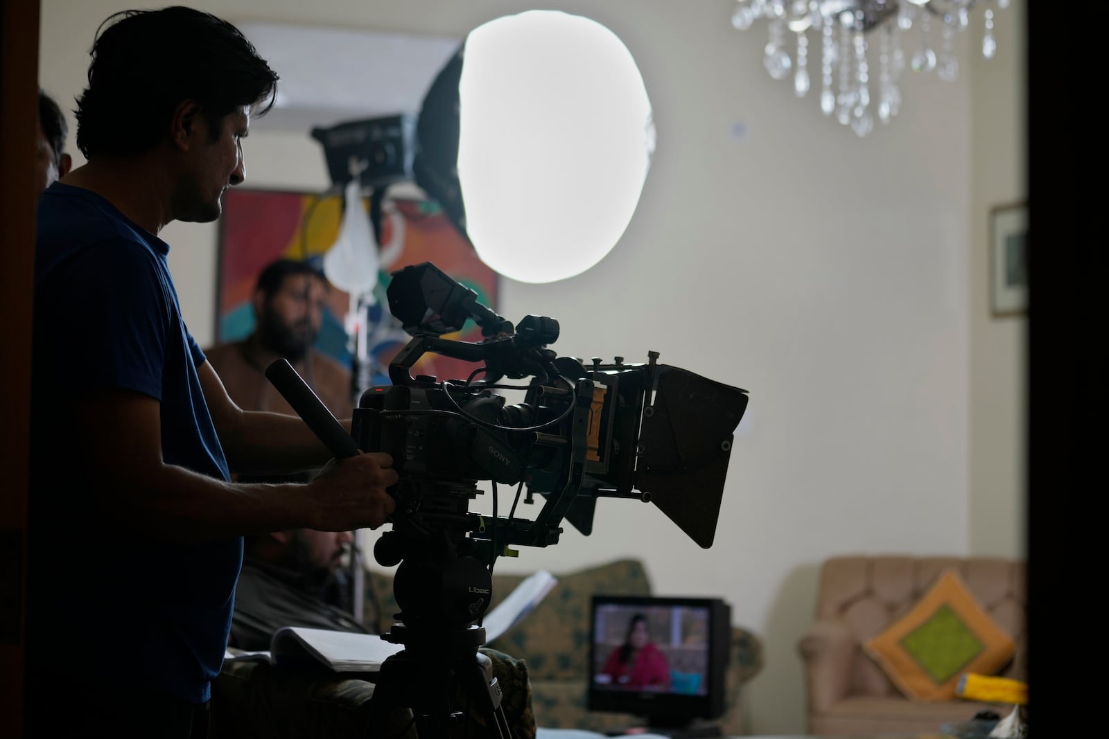 A cameraman films on the set during the during the shooting of a scene of tv drama serial "Aadi Si Bewai' or 'Half-hearted', in Islamabad, Pakistan, Tuesday, Oct. 29, 2024. (AP Photo/Anjum Naveed)