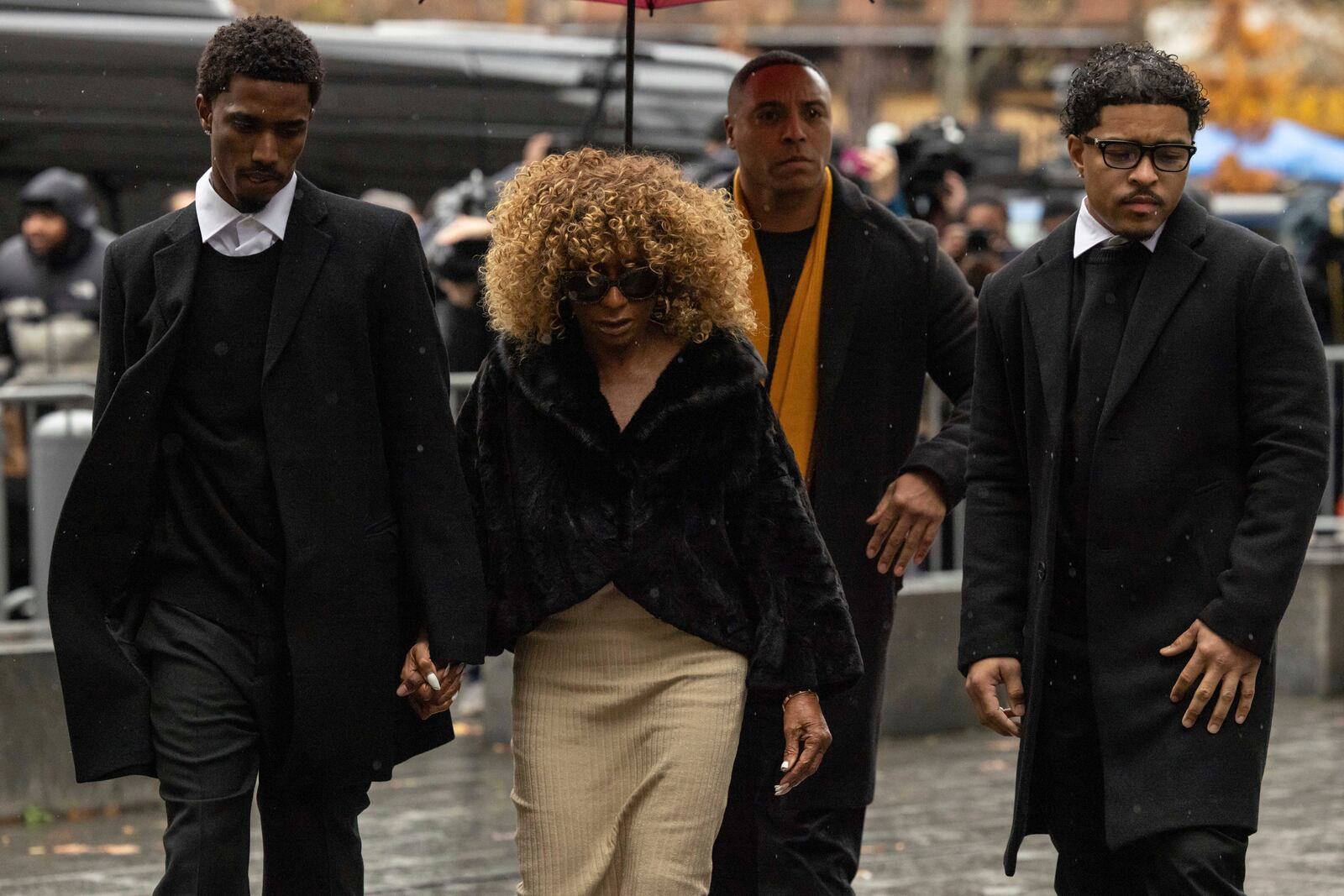 King Combs, left, son, Janice Combs, center, mother, and Justin Dior Combs, right, son of Sean "Diddy" Combs arrive at Manhattan federal court, Friday, Nov. 22 2024, in New York. (AP Photo/Yuki Iwamura)