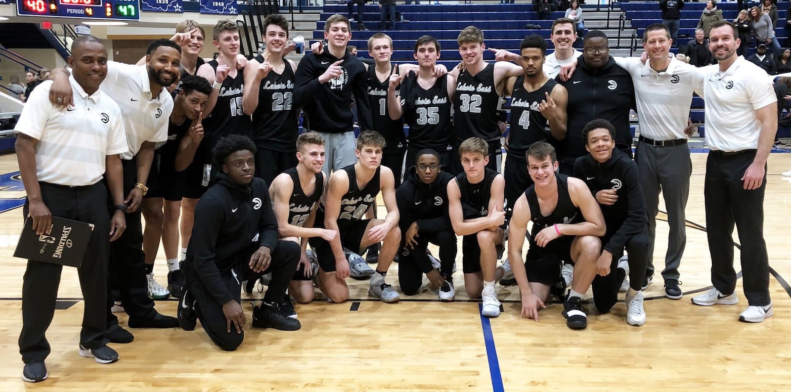 The Lakota East Thunderhawks pose for a photo Tuesday night after winning the outright Greater Miami Conference championship with a 47-40 triumph over Hamilton at the Hamilton Athletic Center. PHOTO COURTESY OF LAKOTA EAST ATHLETICS