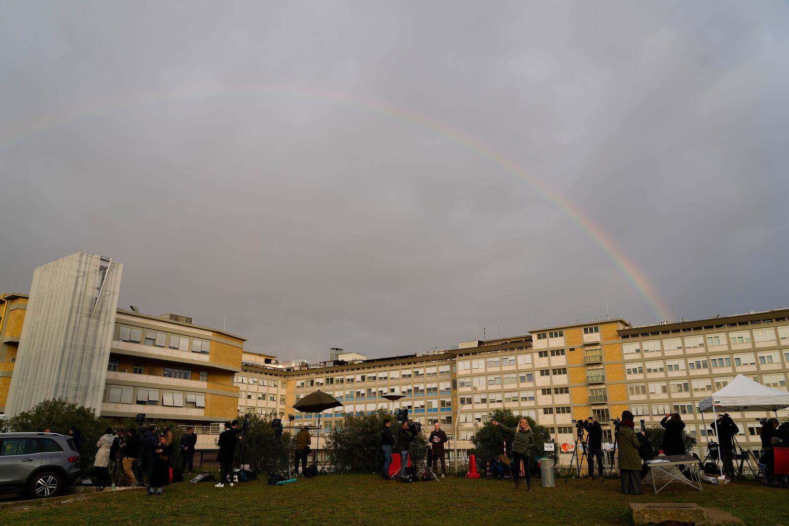 A rainbow shines over the Agostino Gemelli Polyclinic in Rome, Tuesday, Feb. 18, 2025, where Pope Francis was hospitalized Friday, Feb. 14, after a weeklong bout of bronchitis worsened and is receiving drug therapy for a respiratory tract infection. (AP Photo/Gregorio Borgia)