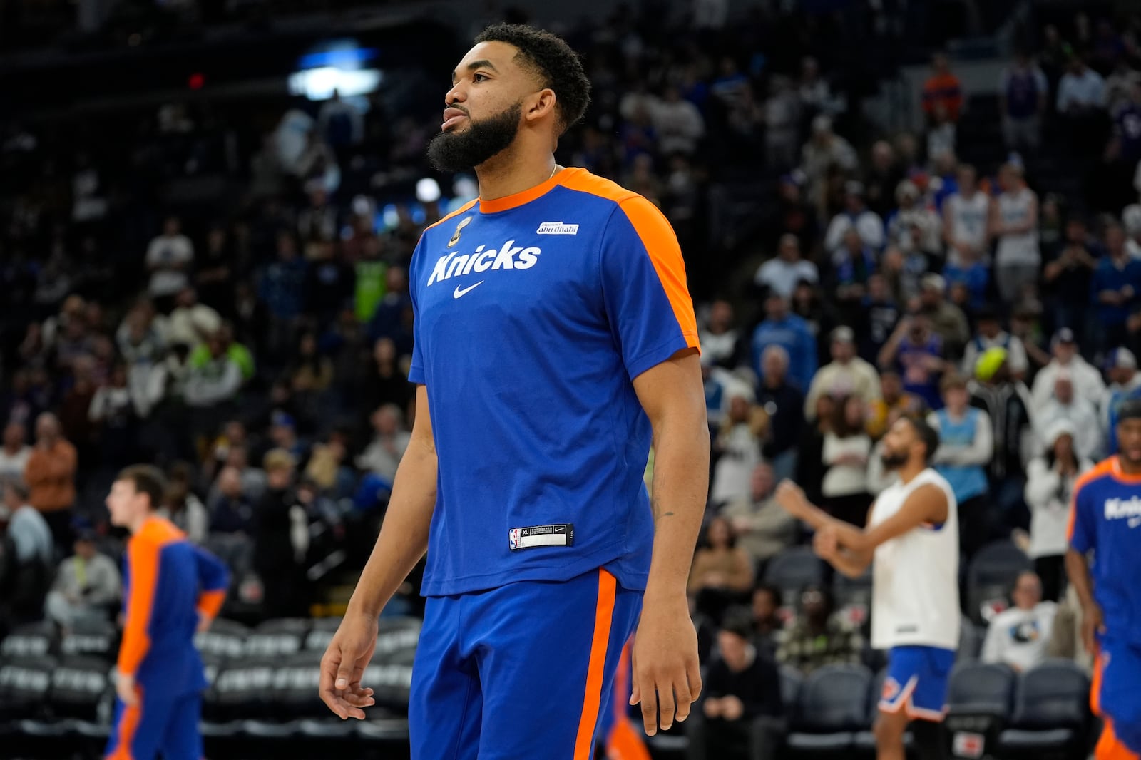 New York Knicks center Karl-Anthony Towns stands on the court before an NBA basketball game against the Minnesota Timberwolves, Thursday, Dec. 19, 2024, in Minneapolis. (AP Photo/Abbie Parr)