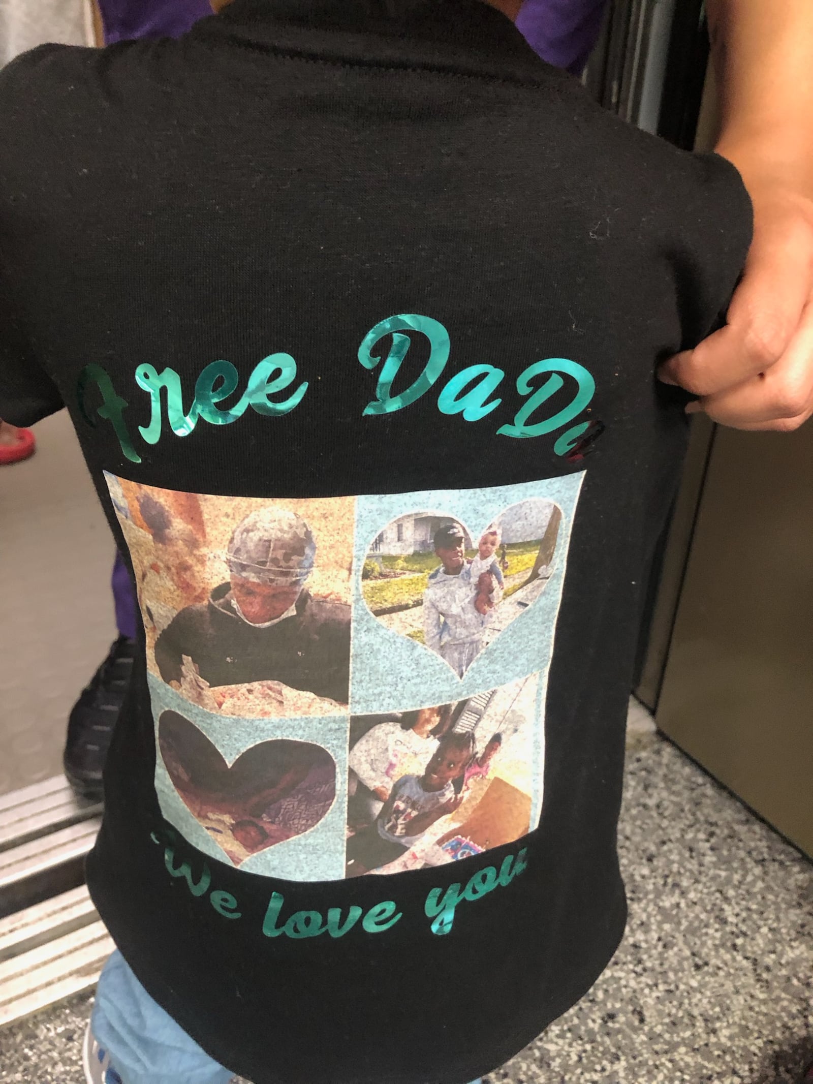 Denzel Fuller's 18-month-old daughter wore this T-shirt to his sentencing Tuesday in Butler County Commons Pleas Court. Fuller was sentenced for 20 to 25 1/2 years for killing his uncle. RICK McCRABB/STAFF