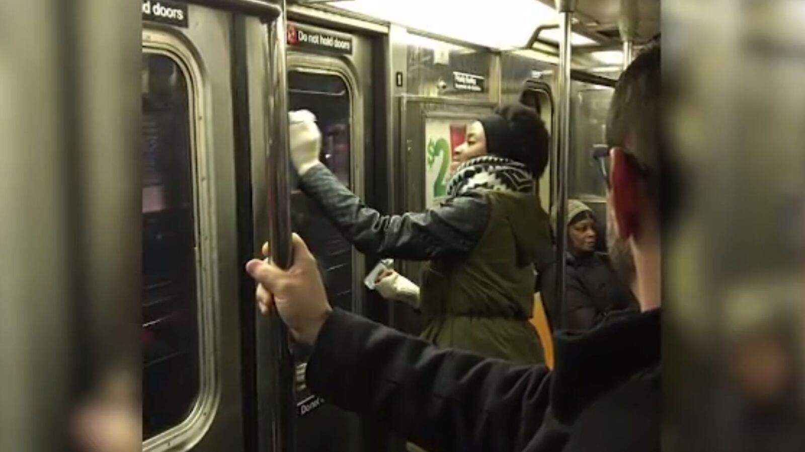 New York commuters used tissues and hand sanitizer to scrub off swastikas that had been scrawled on a subway car.