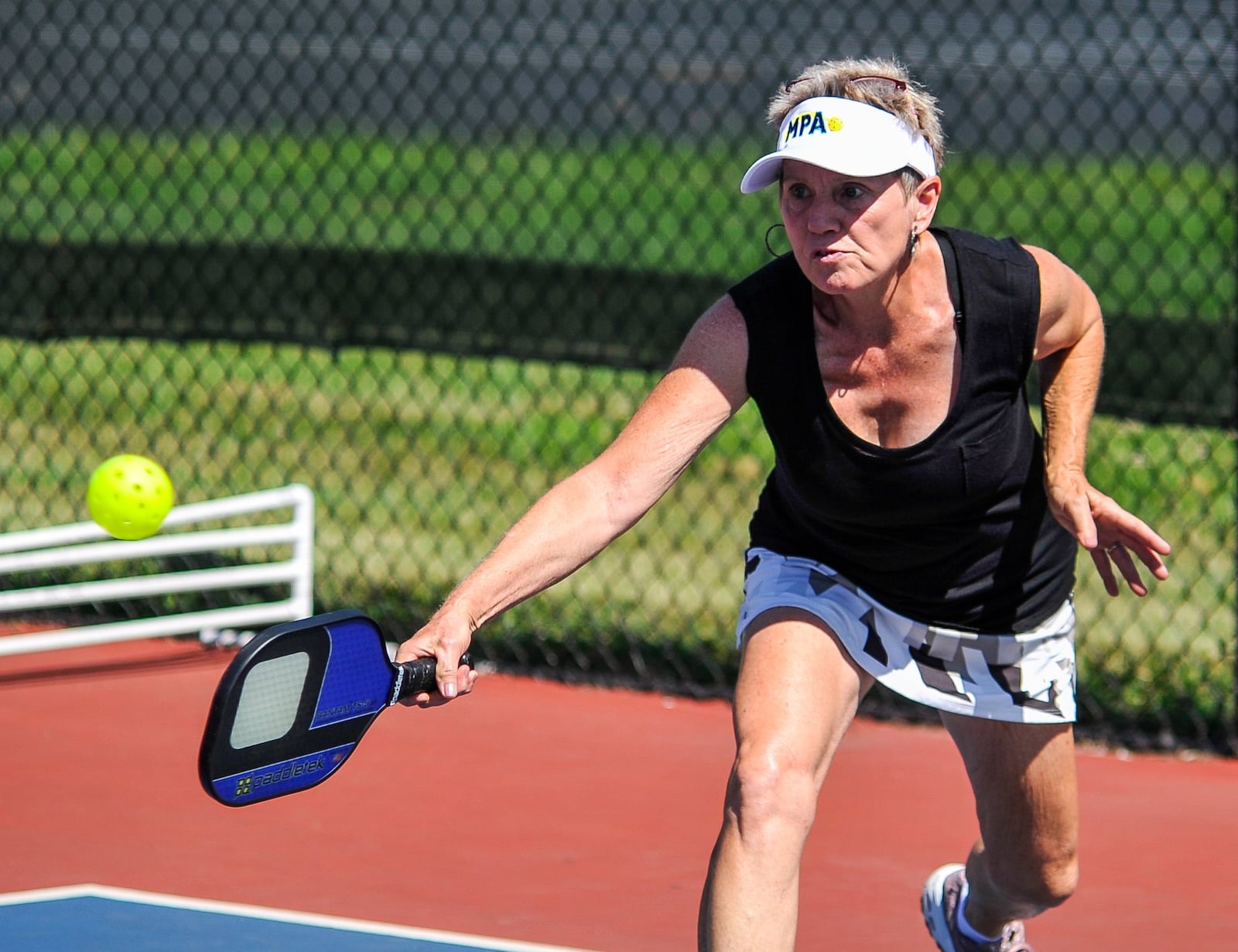 A group plays pickleball Friday, July 12 at the Middletown Pickleball Association courts at Lefferson Park in Middletown. The 12th Annual Middletown Senior Pickleball Tournament is August 1-3 and over 270 players from 8 states are registered to play. Free lessons are offered every Wednesday at 6:00 pm for those interested in playing but new to the sport. Paddles and balls are available to use for those that do not have their own. NICK GRAHAM/STAFF