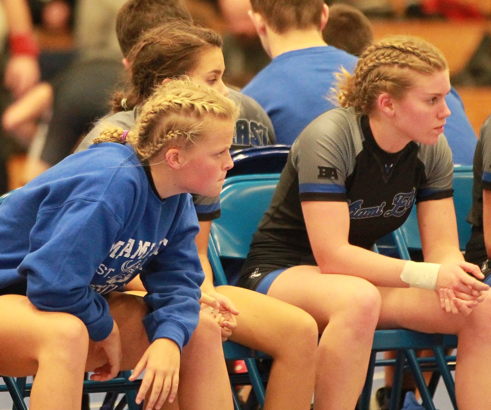 Miami East wrestlers watch intently. Olentangy Orange defeated host Miami East 48-36 in the Ohio’s first girls high school dual wrestling match on Wednesday, Dec. 18, 2019. MARC PENDLETON / STAFF