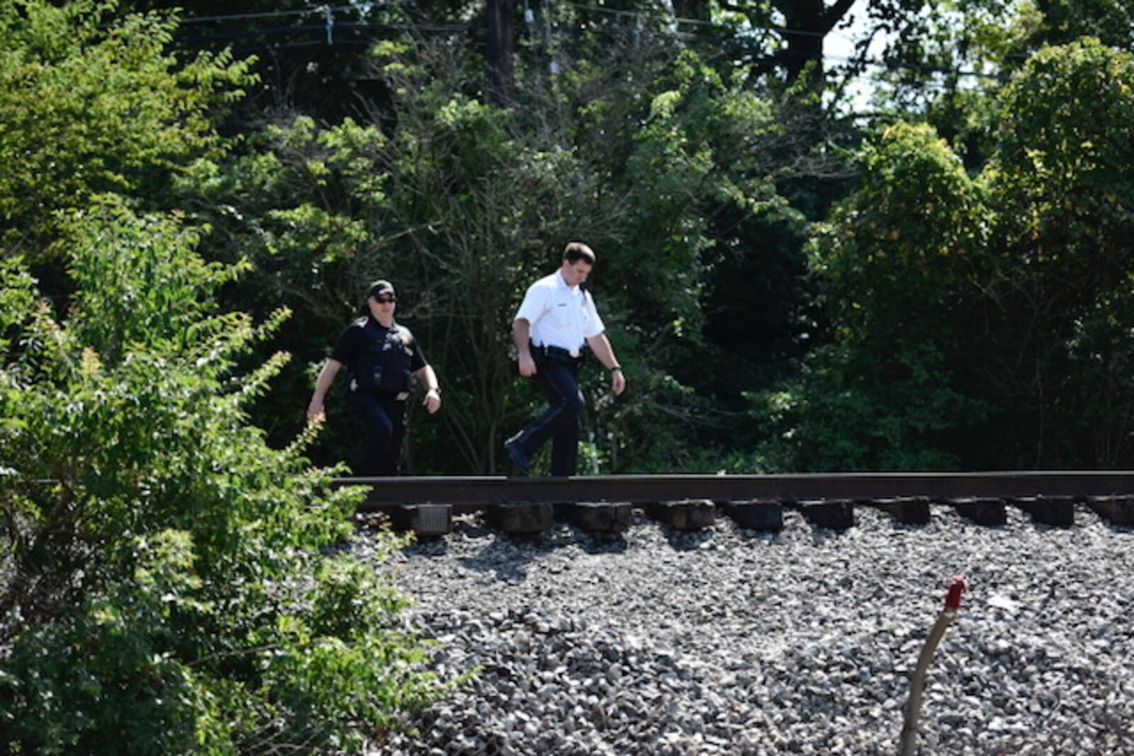 CSX Transportation employees called the Hamilton Police Department for help Thursday morning with people from a homeless camp near railroad tracks in the Lindenwald area on Dixie Highway. 