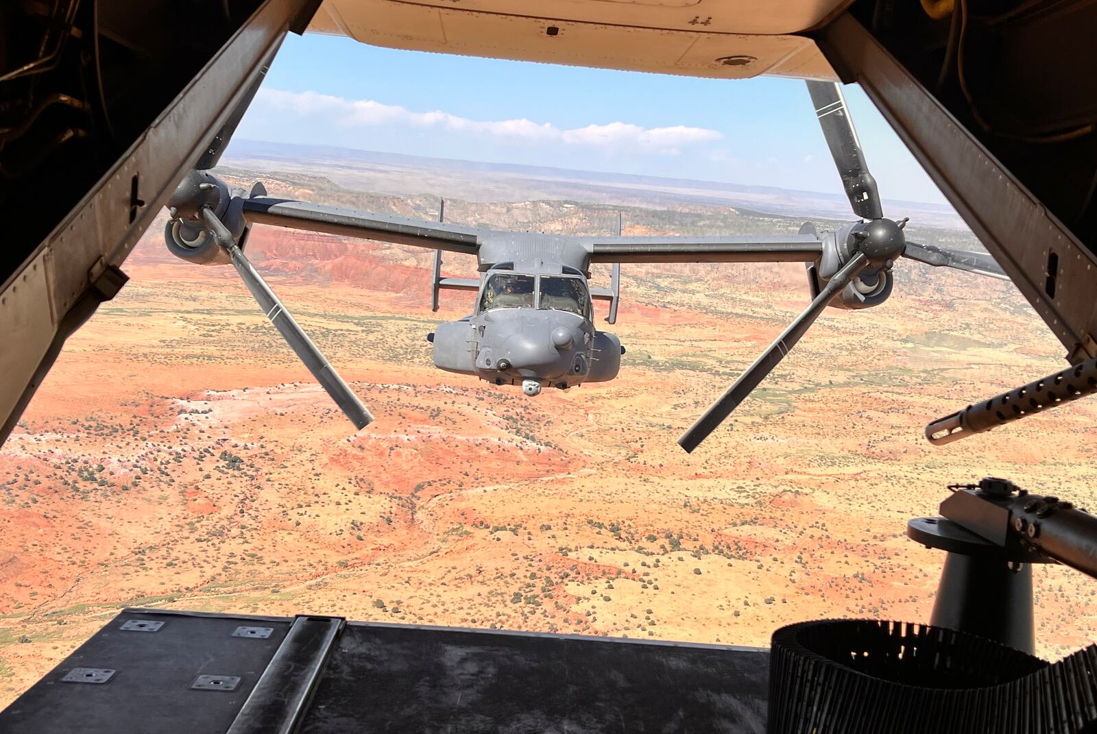 Two Air Force Special Operations Command CV-22B Ospreys fly low and fast in formation on a training range named the Hornet at Cannon Air Force Base, N.M., Oct. 9, 2024. (AP Photo/Tara Copp)