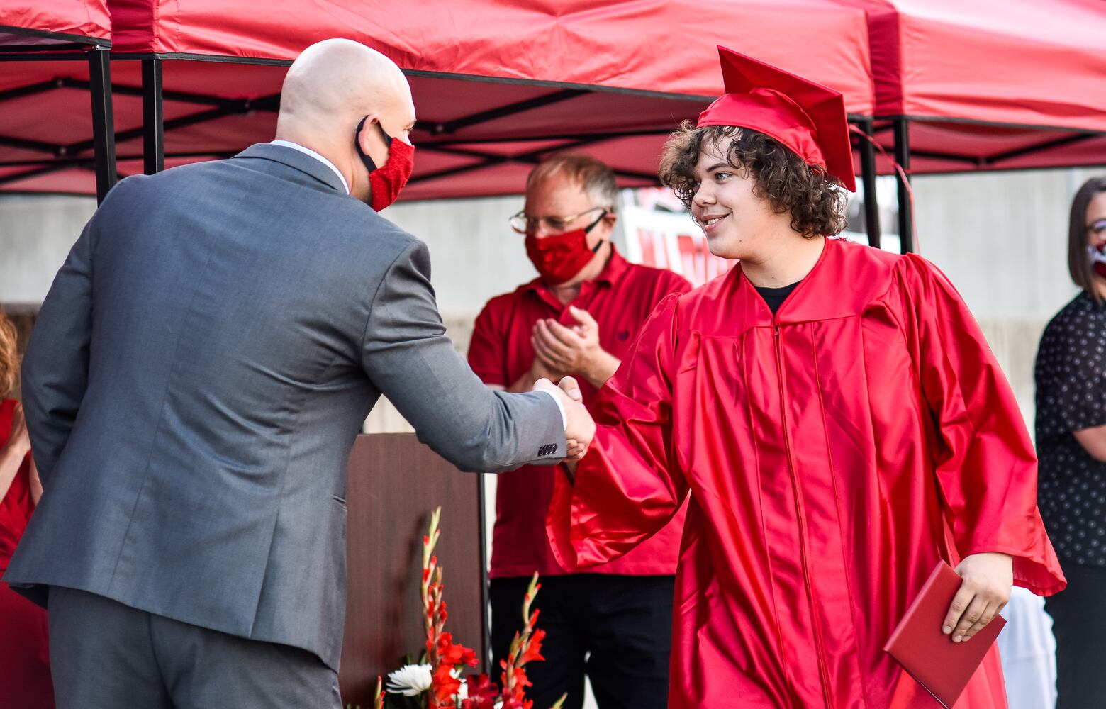 Madison High School drive-thru graduation ceremony at Land of Illusion