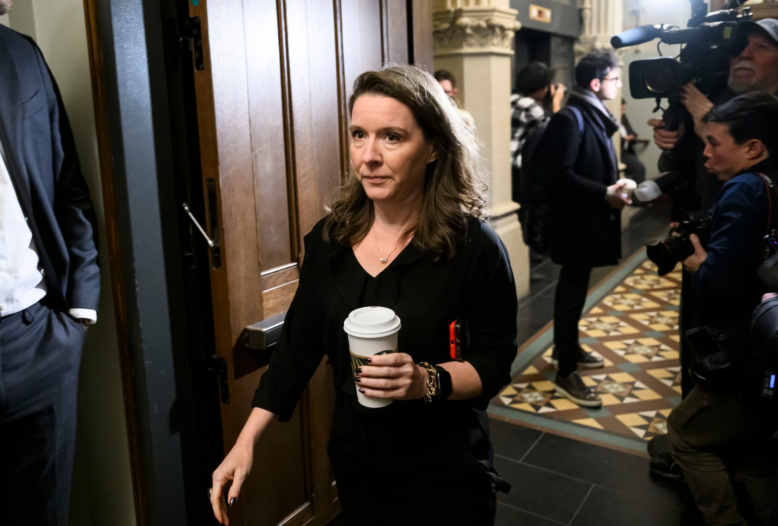 Katie Telford, chief of staff to Prime Minister Justin Trudeau, makes her way to a Liberal Party caucus meeting in West Block on Parliament Hill, in Ottawa, Wednesday, Jan. 8, 2025. (Justin Tang/The Canadian Press via AP)