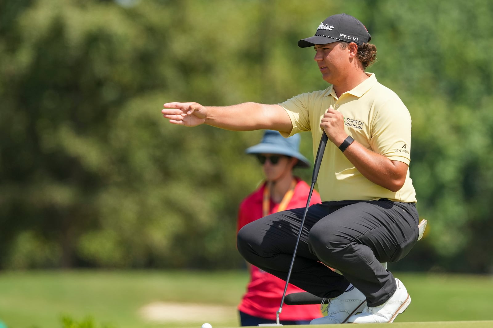 Aldrich Potgieter, of South Africa, lines up his putt on the green of the second hole during the final round of the Mexico Open golf tournament in Puerto Vallarta, Mexico, Sunday, Feb. 23, 2025. (AP Photo/Fernando Llano)