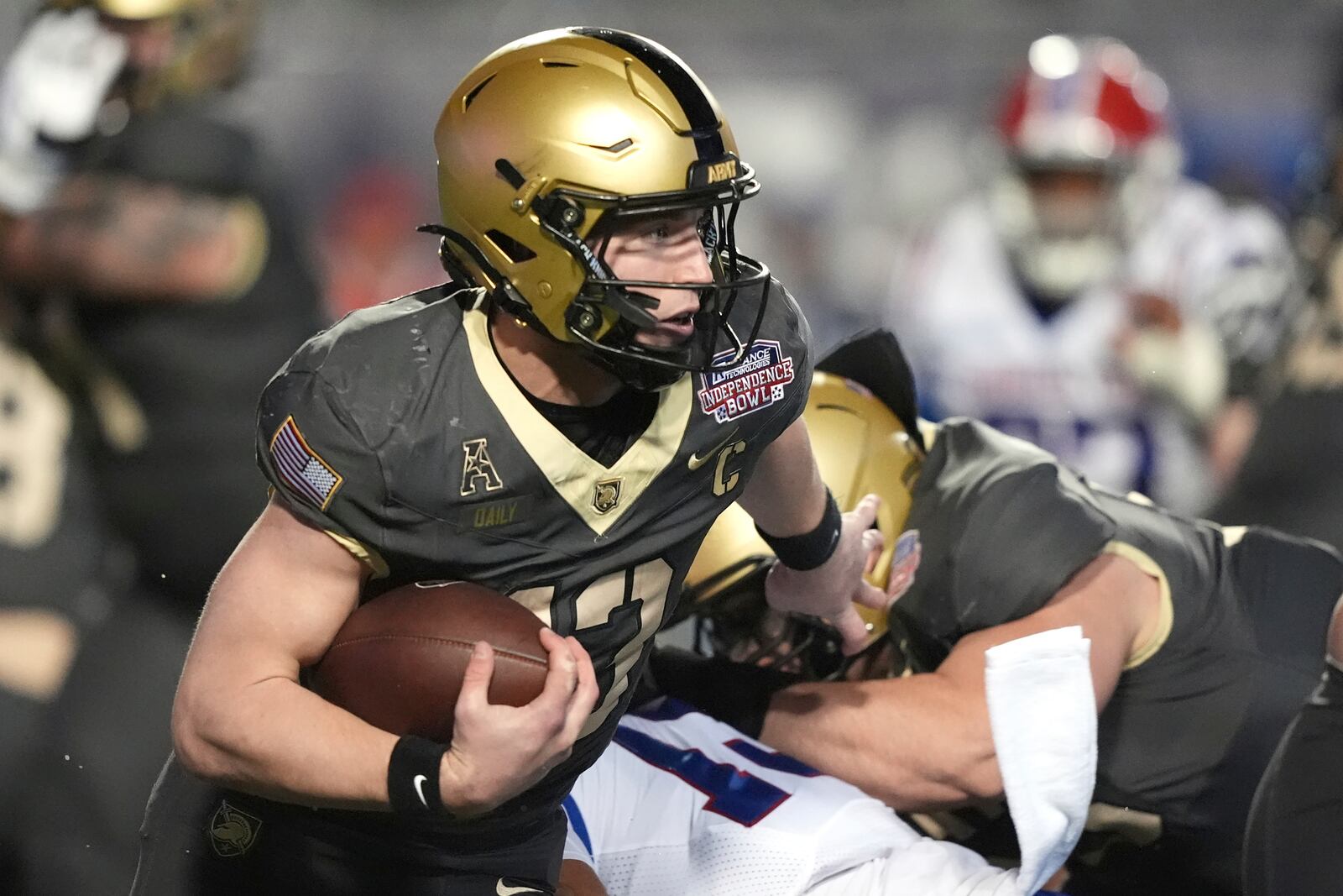 Army quarterback Bryson Daily (13) runs for a first down against Louisiana Tech during the first half of the Independence Bowl NCAA college football game, Saturday, Dec. 28, 2024, in Shreveport, La. (AP Photo/Rogelio V. Solis)