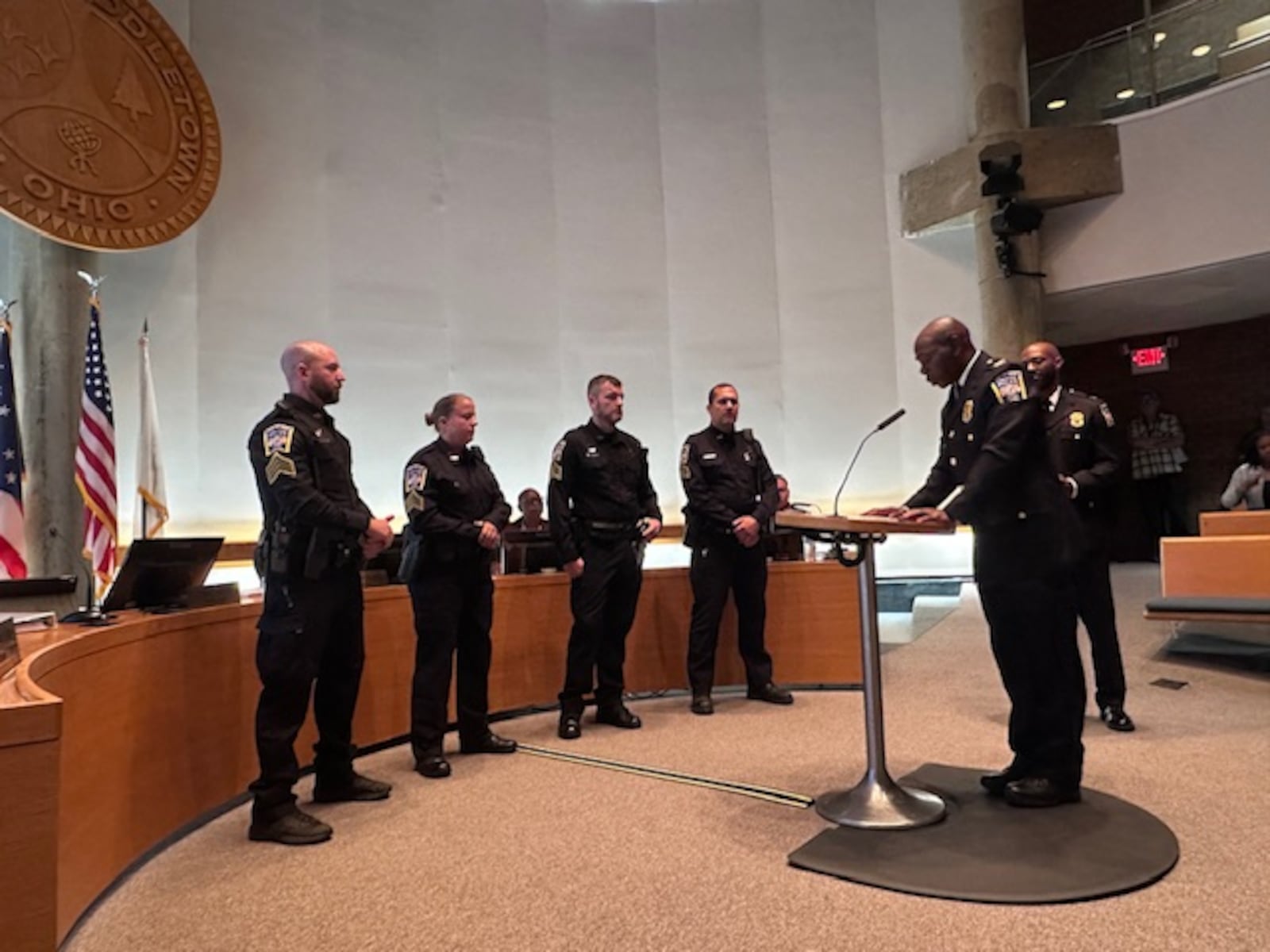 New Middletown Police Sgts. Adam Cox, Lindsay Schwarber, Jordan Wagers, Jason Wargo ( left to right) were promoted Tuesday to their new ranks by Police Chief Earl Nelson (at the podium) CITY OF MIDDLETOWN