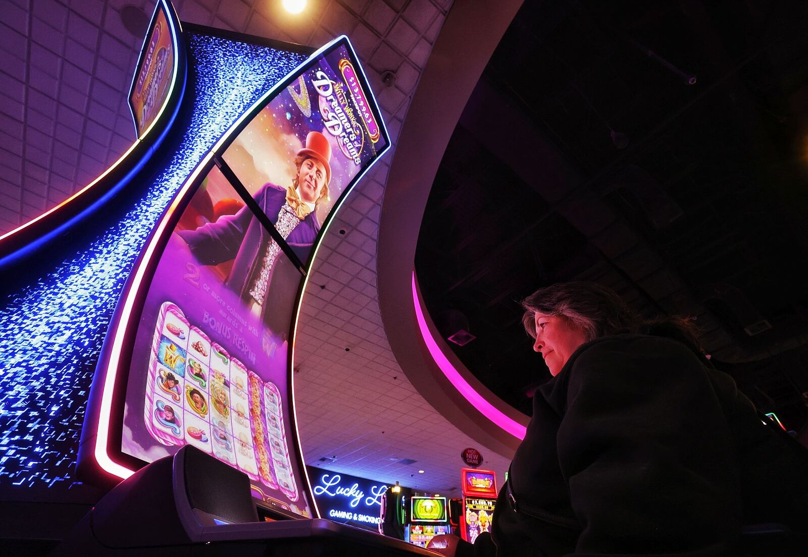 Tami Heinrich plays a game at Miami Valley Gaming that is in the process of expanding its outdoor gaming areas and renovating the former buffet area into two different dining concepts. NICK GRAHAM / STAFF