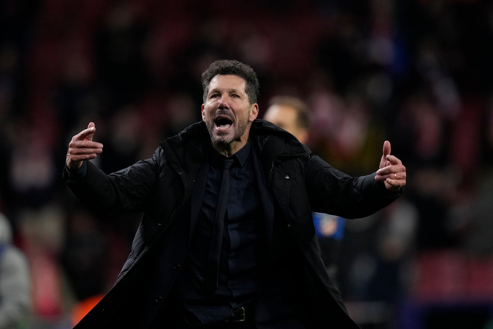 Atletico Madrid's head coach Diego Simeone reacts after losing the penalty shootout during the Champions League round of 16, second leg, soccer match between Atletico Madrid and Real Madrid at the Metropolitano stadium in Madrid, Spain, Wednesday, March 12, 2025. (AP Photo/Bernat Armangue)