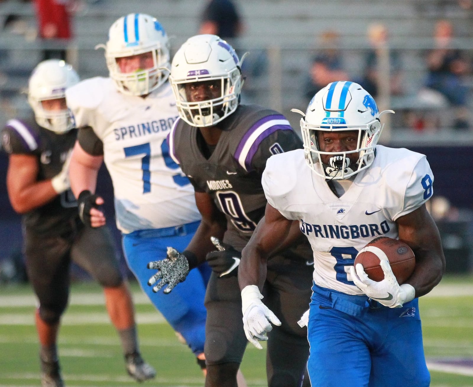 Moise Armbruster of Springboro (with ball) runs away from Middletown defender Cheik Fall. Springboro defeated host Middletown 37-14 in a Week 2 high school football game at Barnitz Stadium on Friday, Sept. 7, 2019. MARC PENDLETON / STAFF