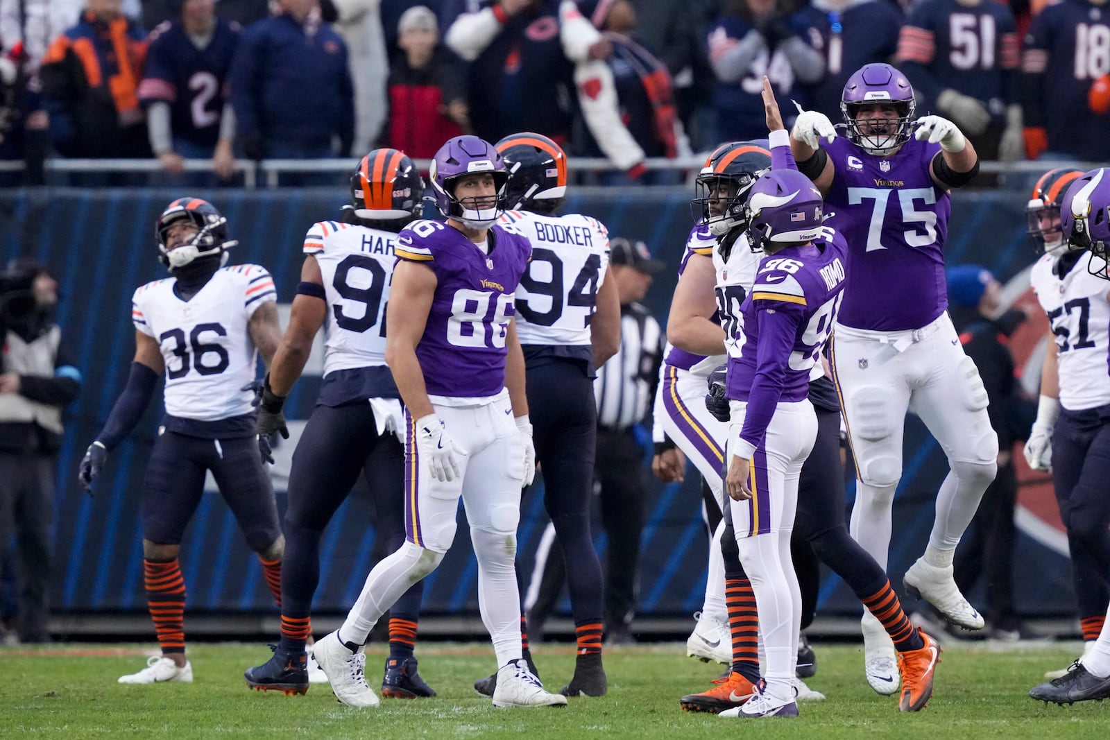 Minnesota Vikings place kicker Parker Romo (96) celebrates his game-wining field goal with teammates in overtime of an NFL football game against the Chicago Bears, Sunday, Nov. 24, 2024, in Chicago. (AP Photo/Charles Rex Arbogast)