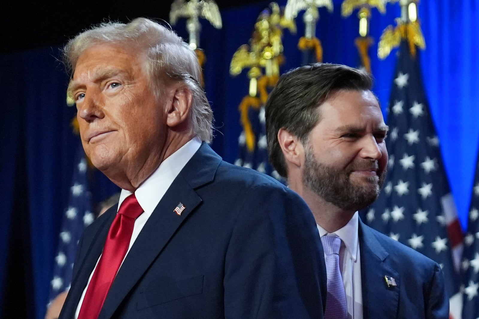 FILE - Republican presidential nominee former President Donald Trump, left, with Republican vice presidential nominee Sen. JD Vance, R-Ohio, right, are pictured at an election night watch party, Nov. 6, 2024, in West Palm Beach, Fla. (AP Photo/Evan Vucci, File)