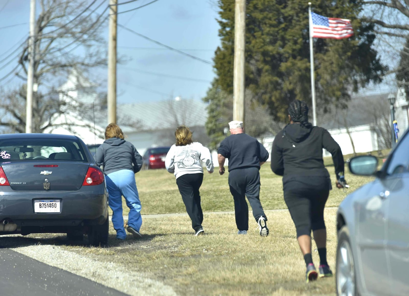 Parents parked along OH 122 run to see if they are allowed to pick up their kids after a shooting at Madison Jr./Sr. High School Monday, Feb. 29 in Madison Township in Butler County. The shooter, a 14-year- student, was taken into custody. NICK GRAHAM/STAFF