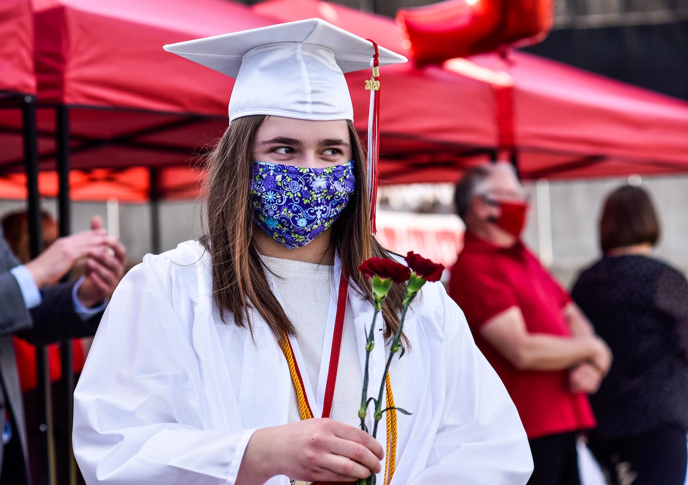 Madison High School drive-thru graduation ceremony at Land of Illusion