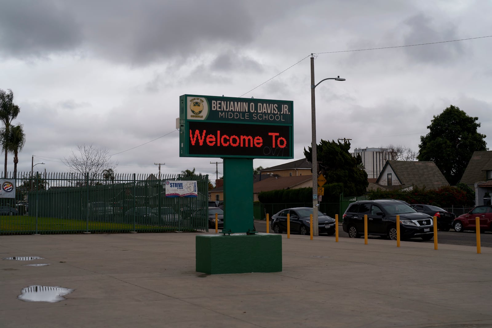 A sign is seen in front of Benjamin O. Davis Middle School in Compton, Calif., Thursday, Feb. 6, 2025. (AP Photo/Eric Thayer)