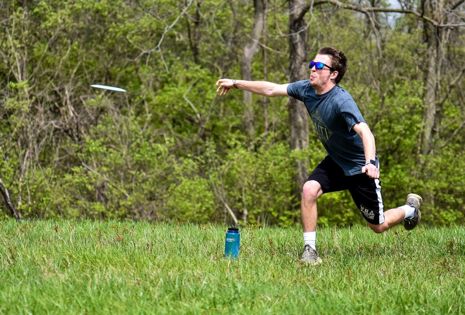 Miami student Nick Farrell tees off as he plays disc golf back in April at Harbin Park in Fairfield. NICK GRAHAM/STAFF