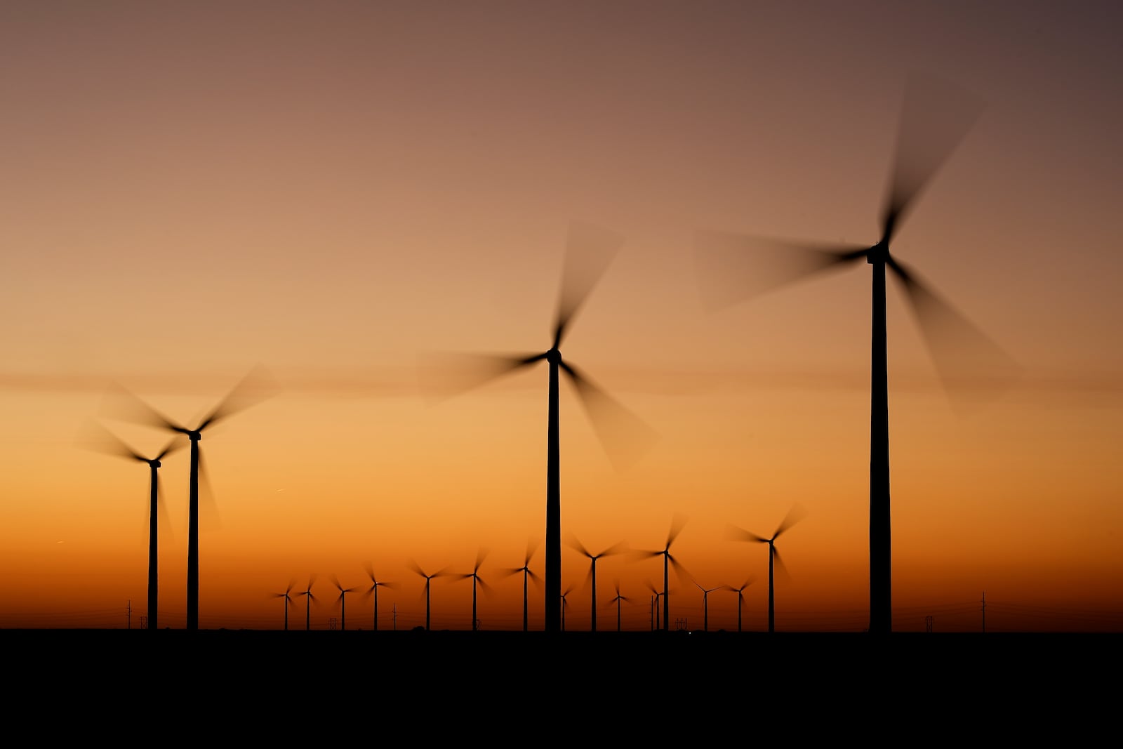 FILE - Wind turbines stretch across the horizon at dusk at the Spearville Wind Farm, Sept. 29, 2024, near Spearville, Kan. (AP Photo/Charlie Riedel, File)