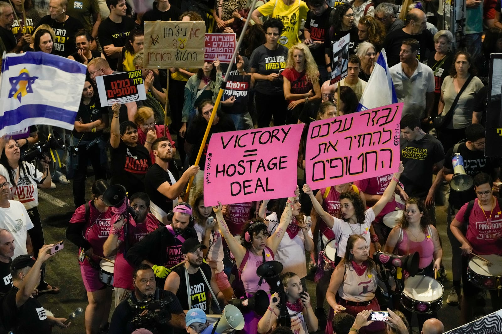 People protest against Prime Minister Benjamin Netanyahu's government and call for the release of hostages held in the Gaza Strip by the Hamas militant group, in Tel Aviv, Israel, Saturday, Oct. 19, 2024. (AP Photo/Mahmoud Illean)