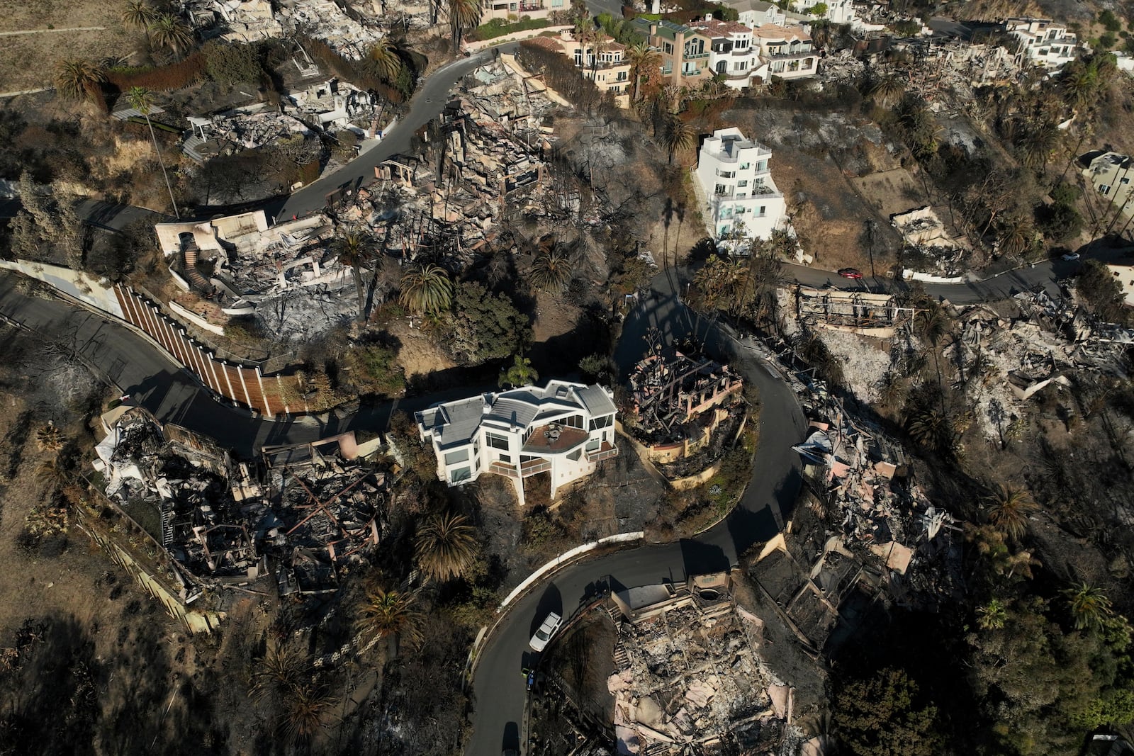 FILE - Devastation from the Palisades Fire is visible on Jan. 16, 2025, in Malibu, Calif. (AP Photo/Jae C. Hong, File)